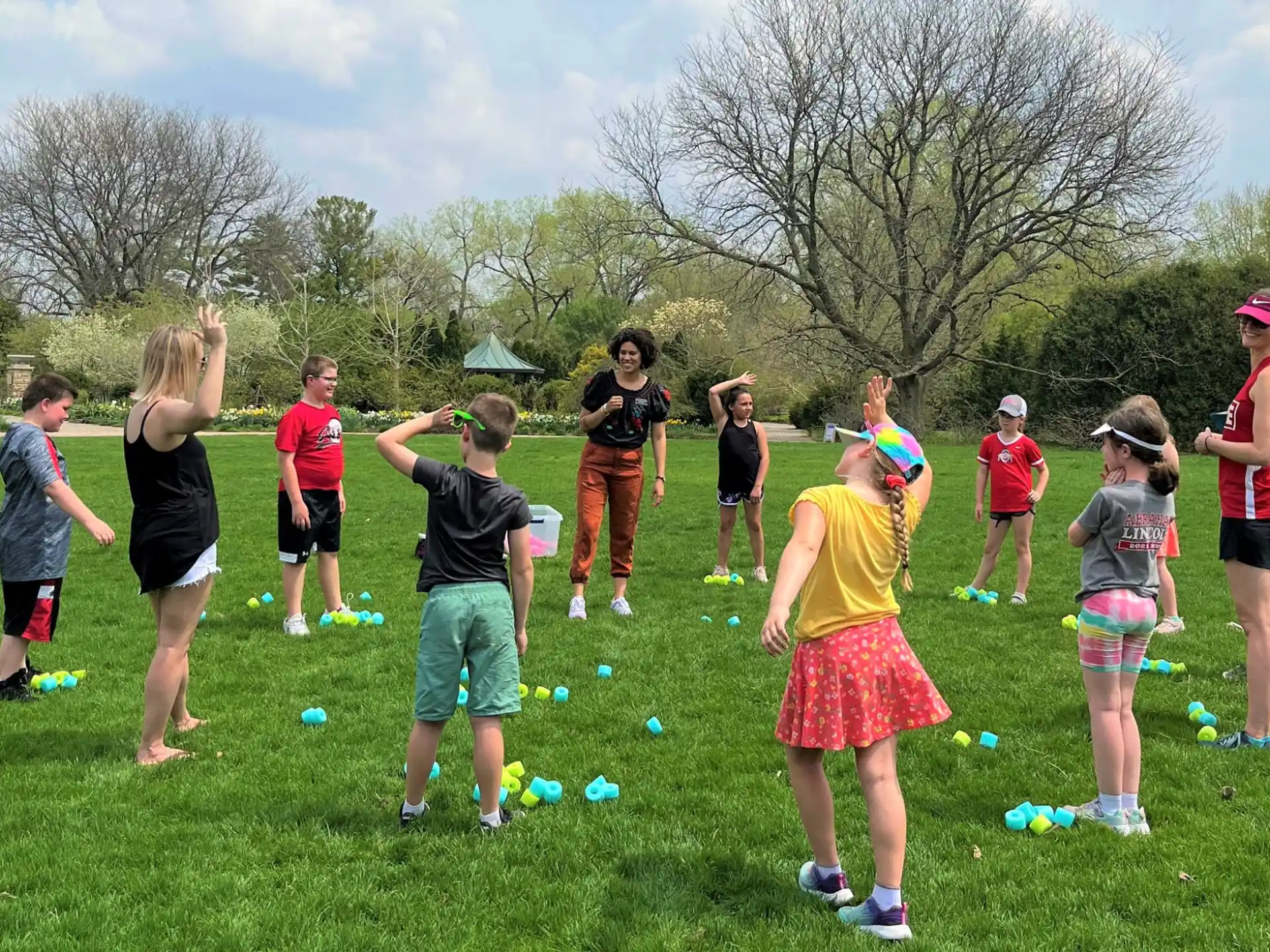 a group of people playing with balls
