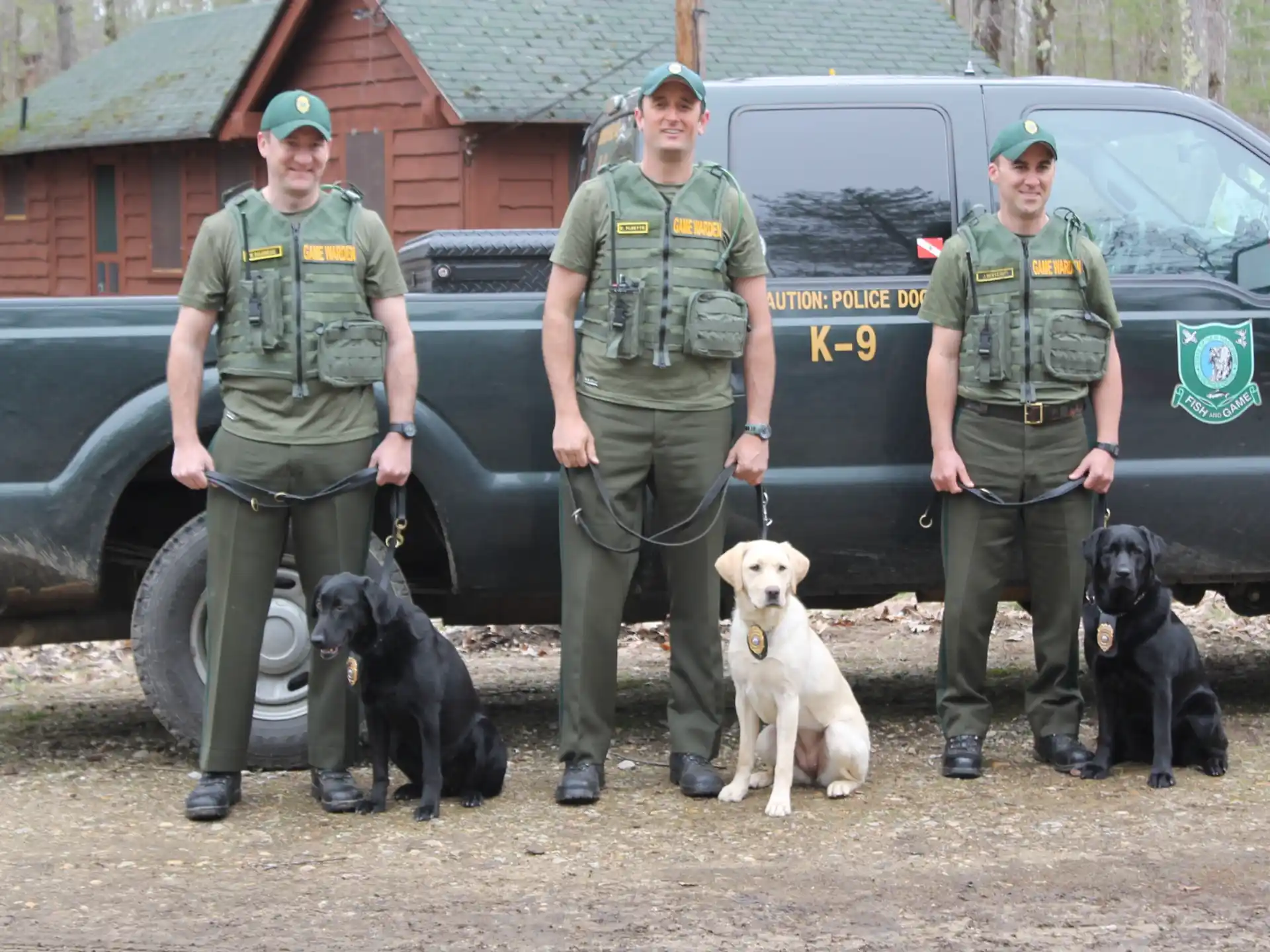 a group of men with dogs