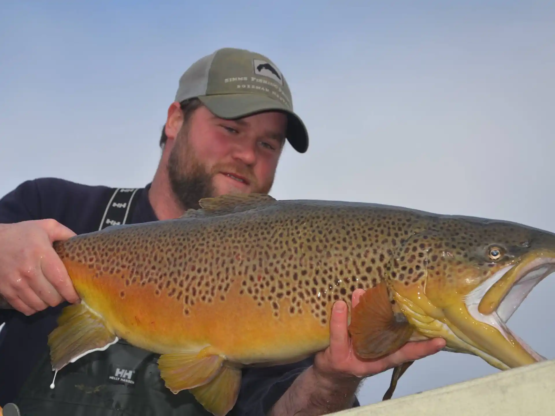 a man holding a fish