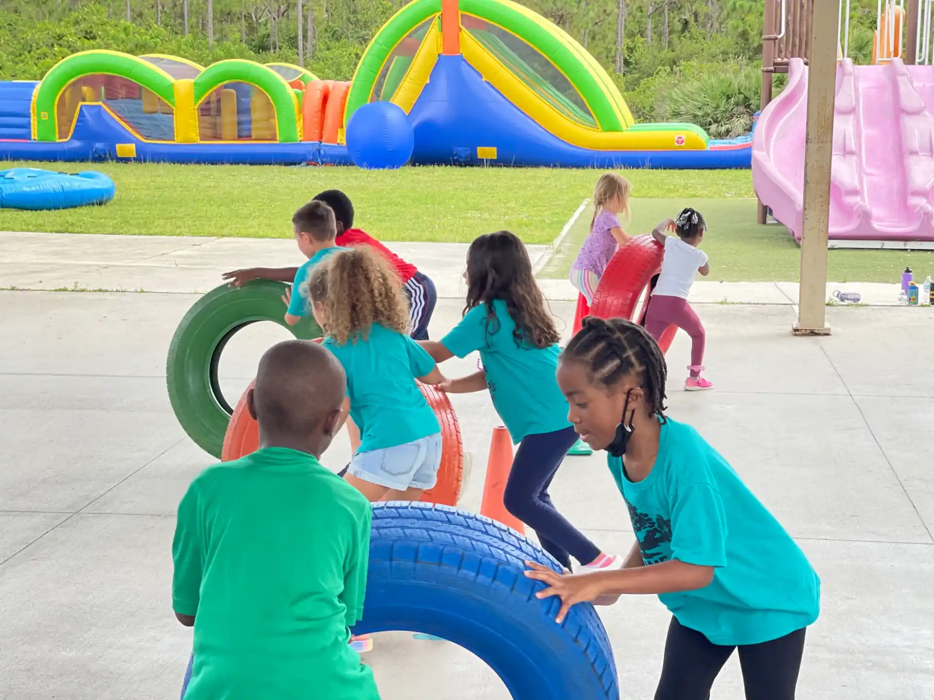 a group of children playing in a playground