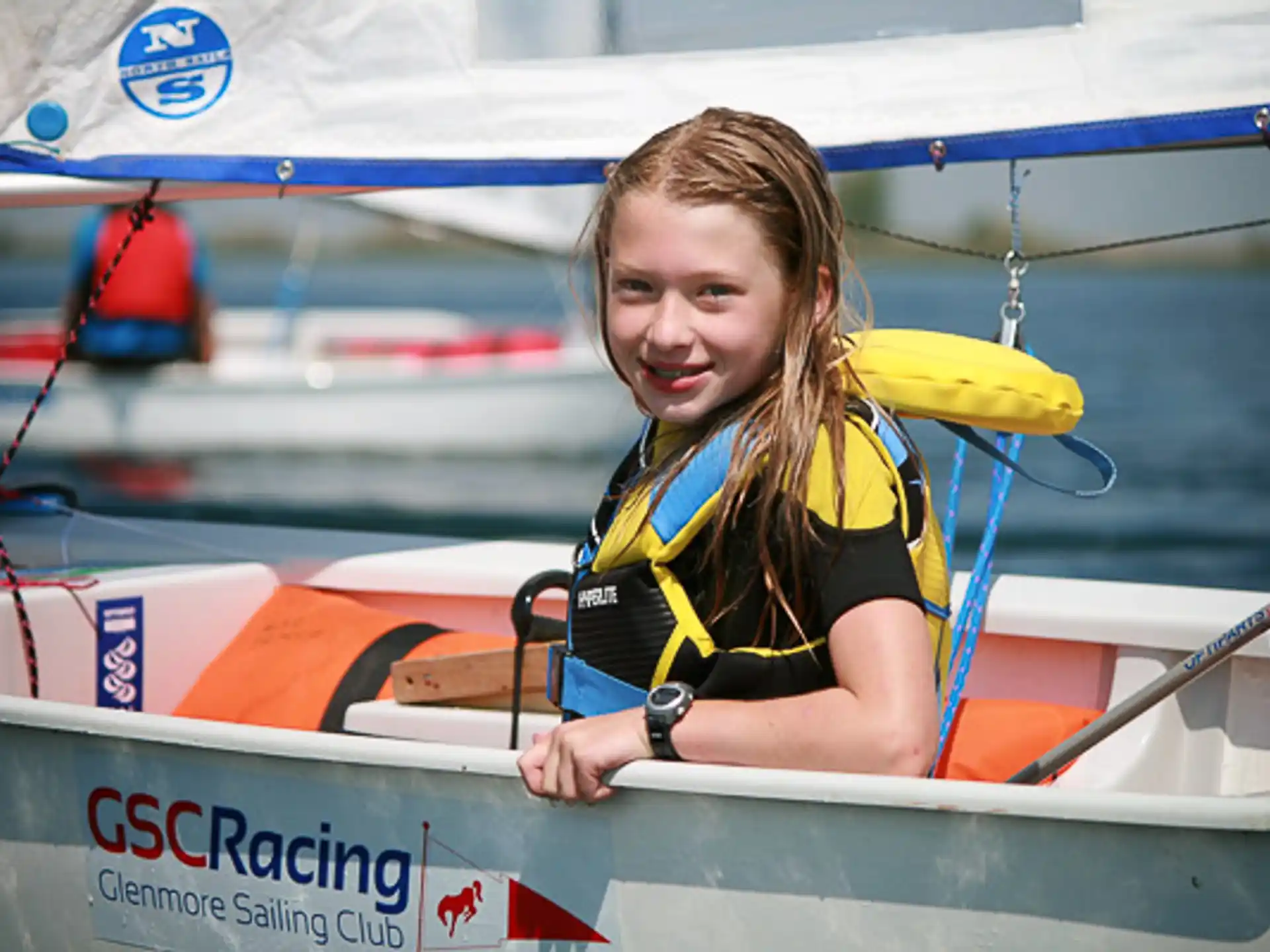 a person in a yellow shirt in a boat