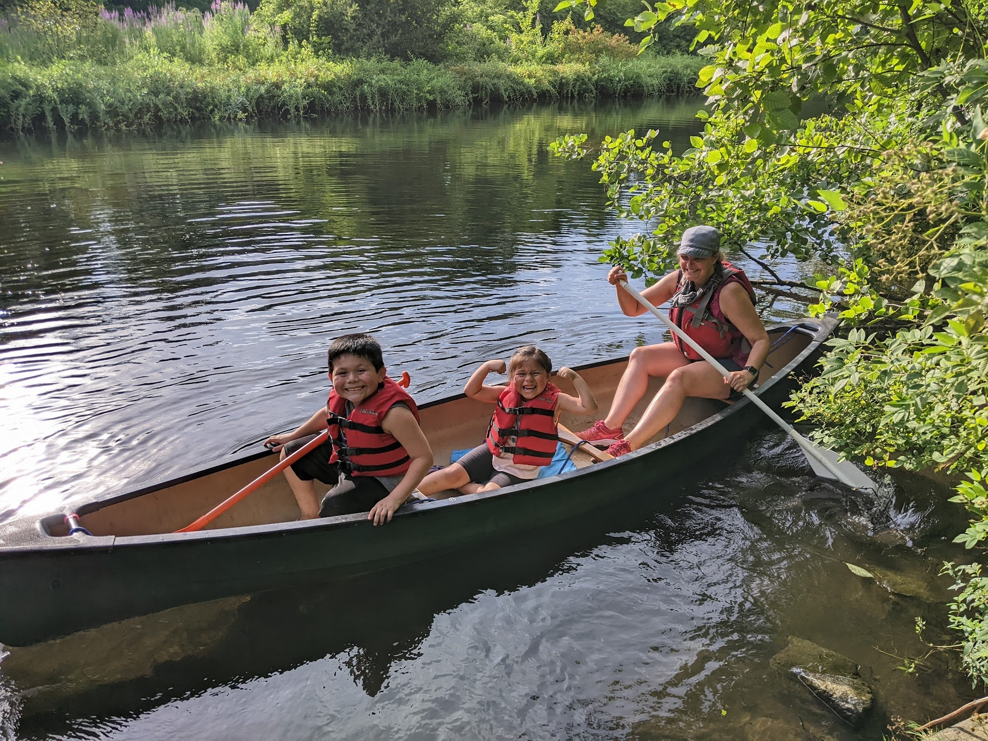 a group of people in a canoe