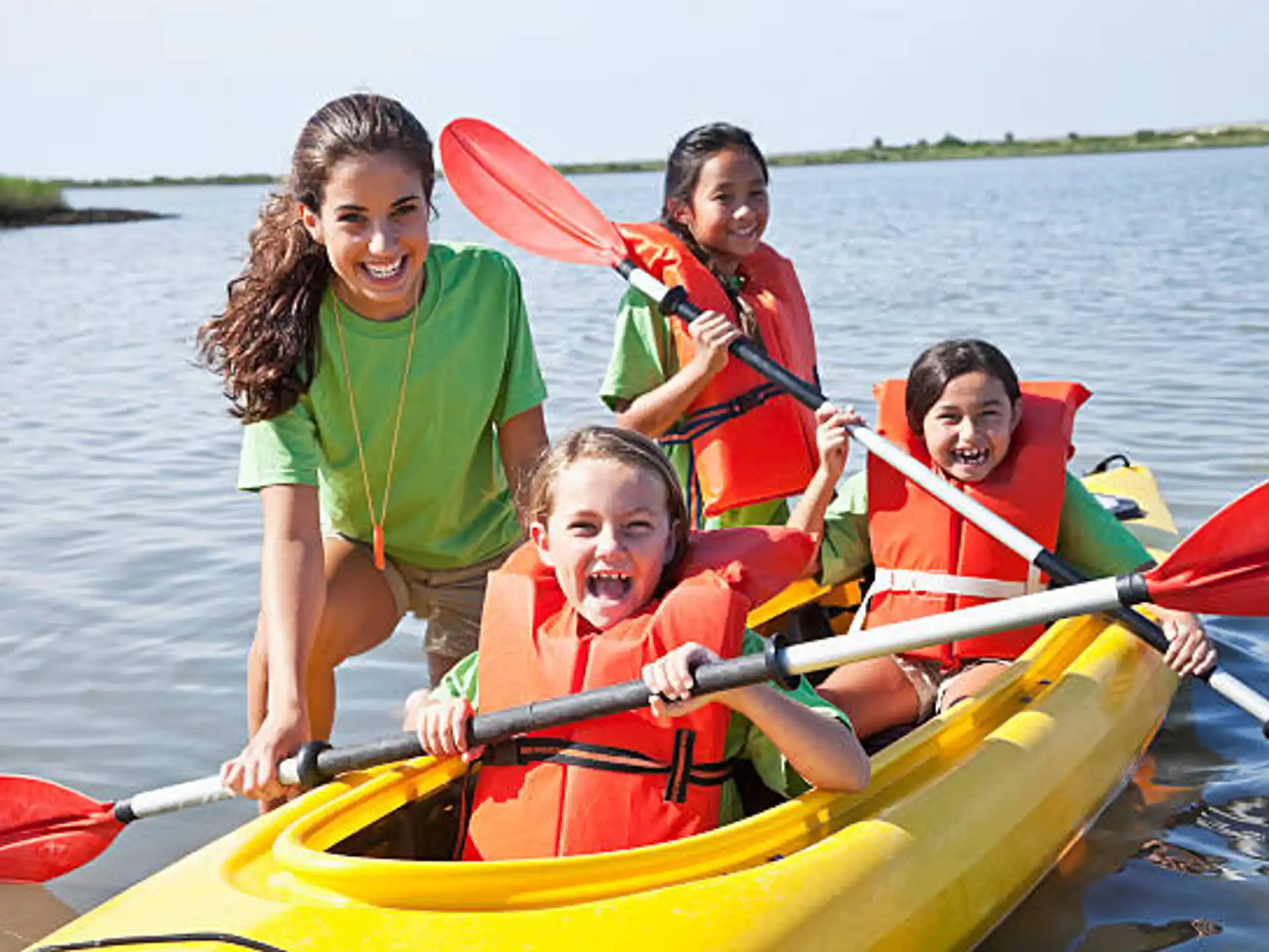 a group of people in a canoe