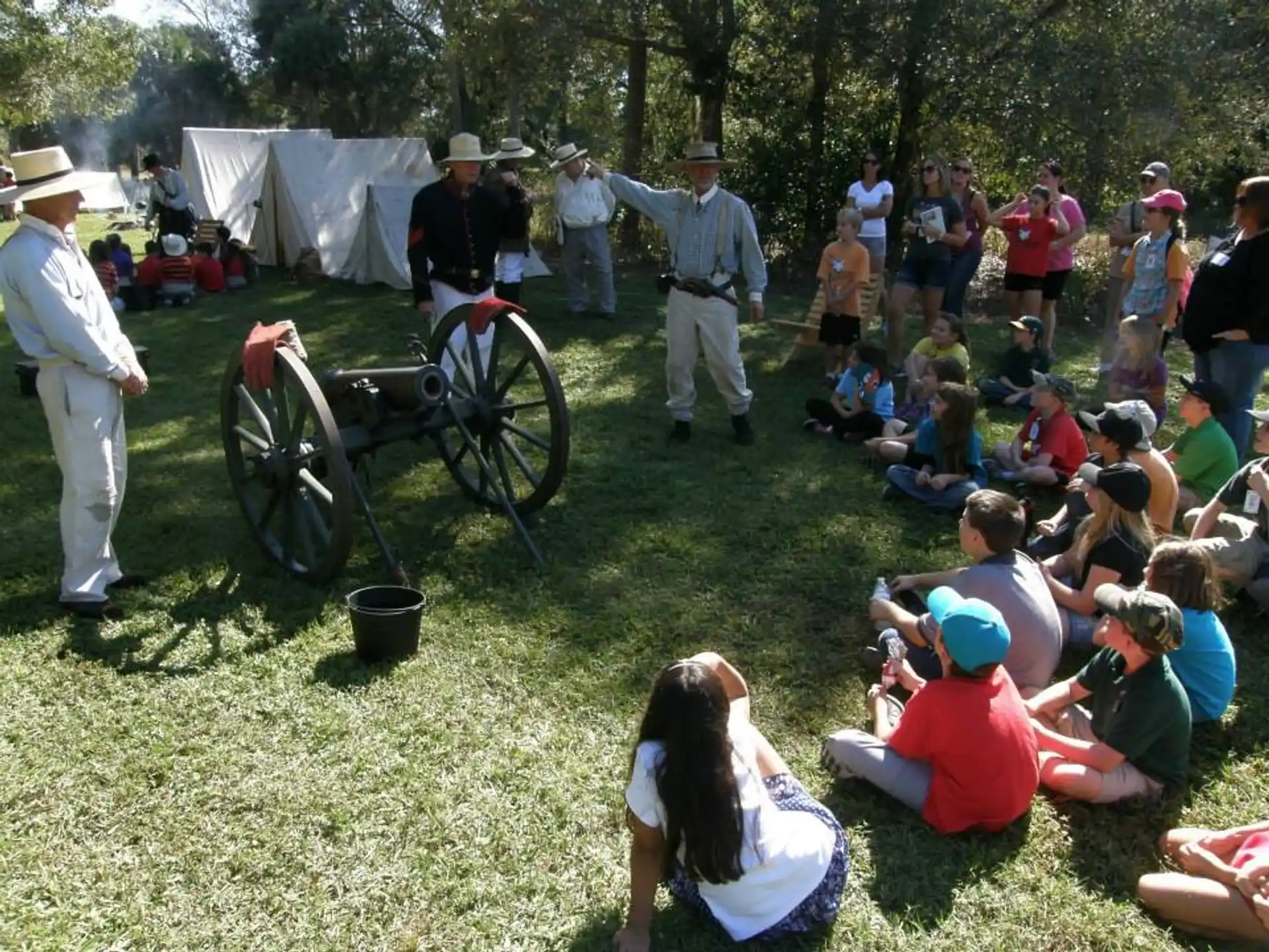 a group of people watching a person in a wheelchair