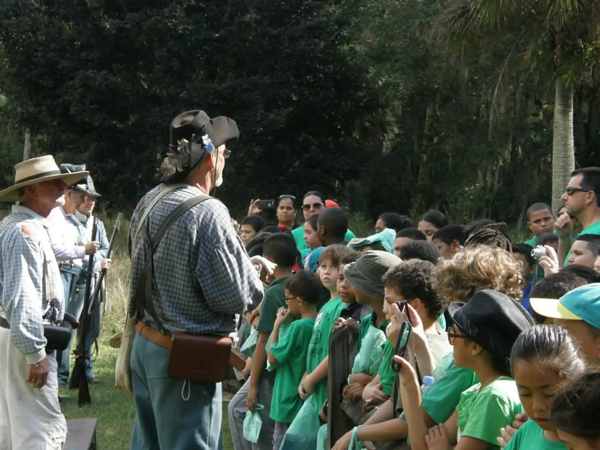 a person speaking to a group of children