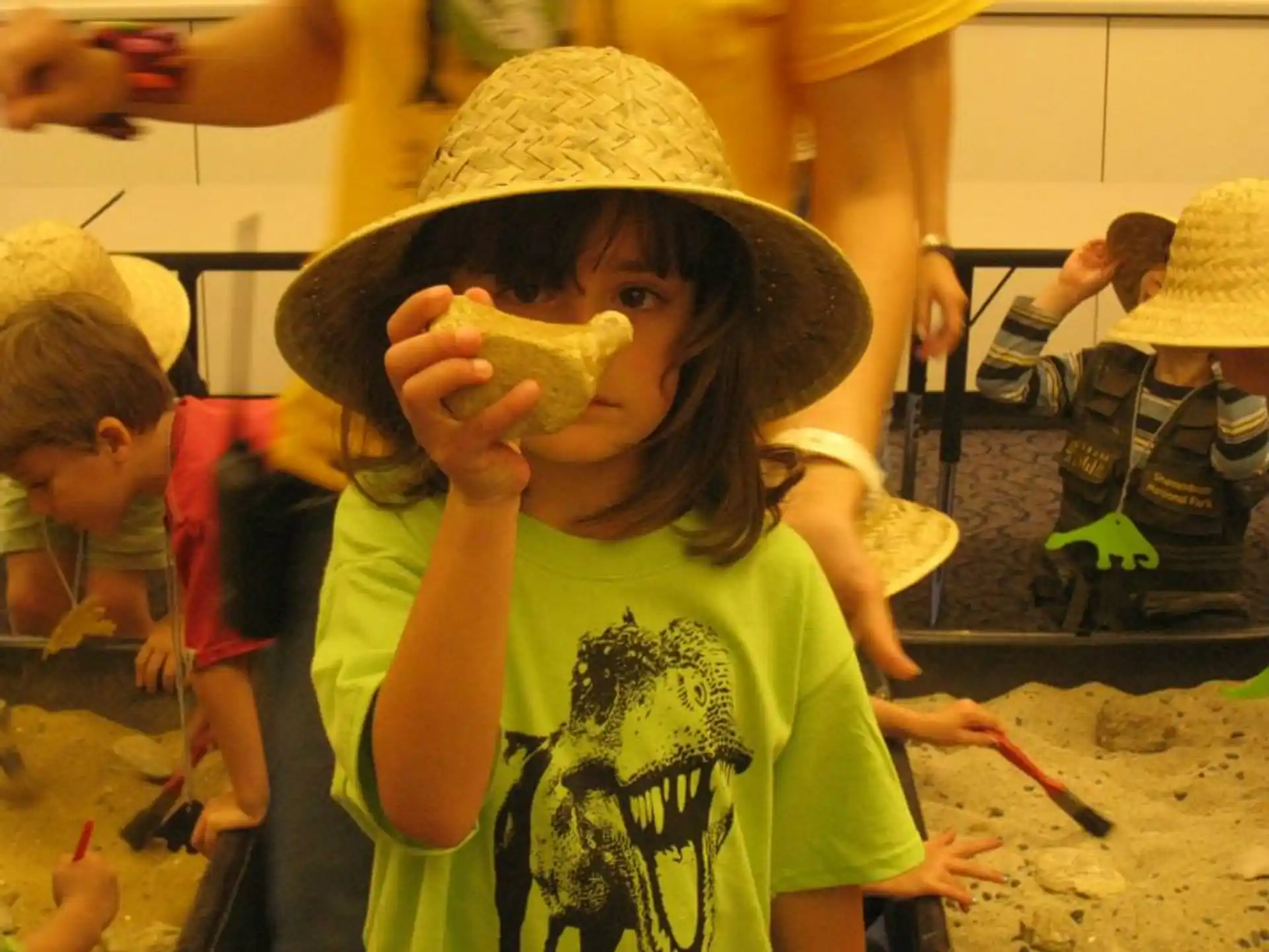 a young boy eating a banana