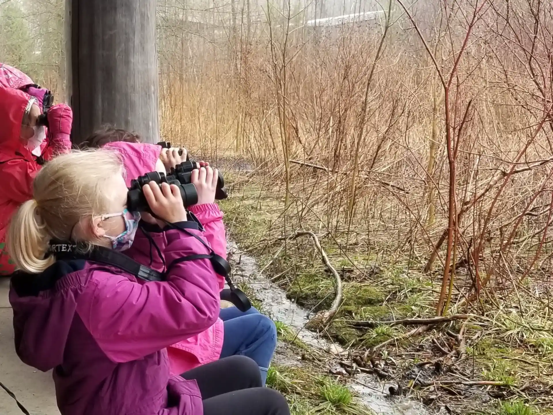 a woman taking a picture with a camera