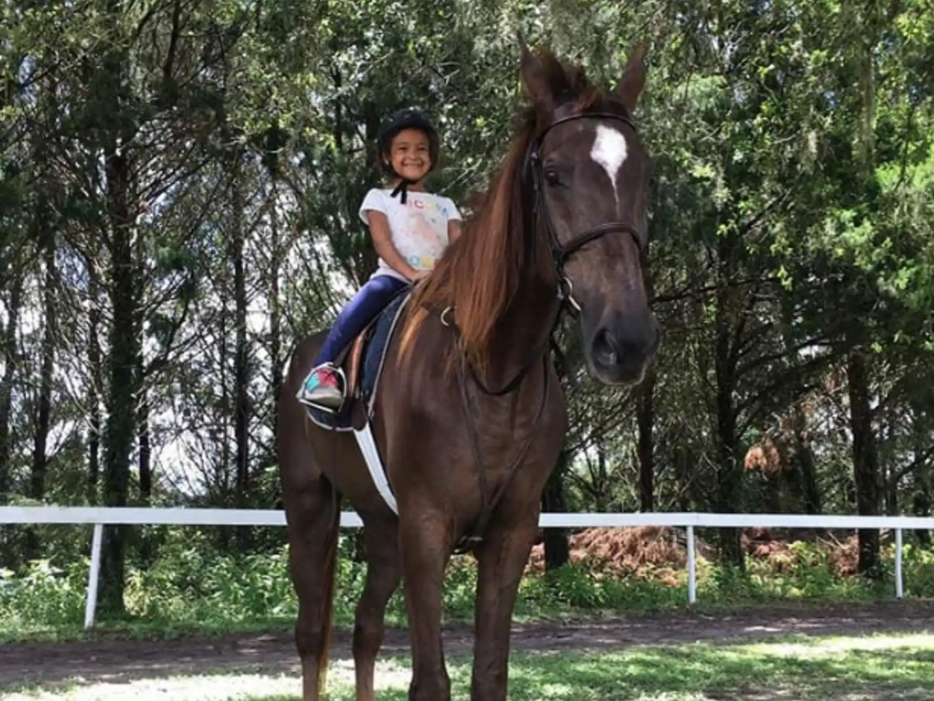 a girl riding a horse