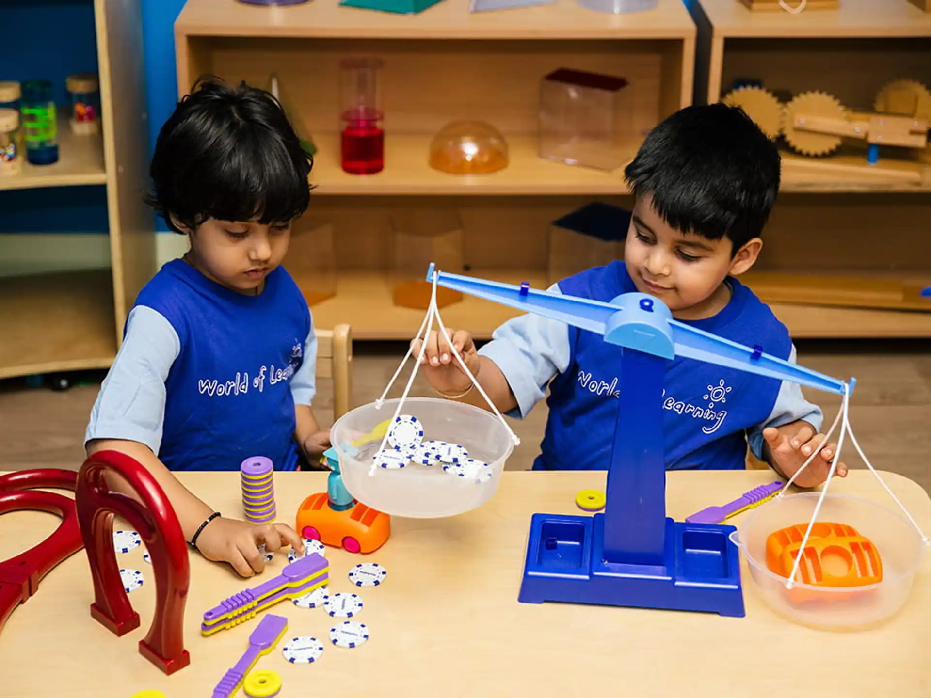 a couple of kids playing with toys
