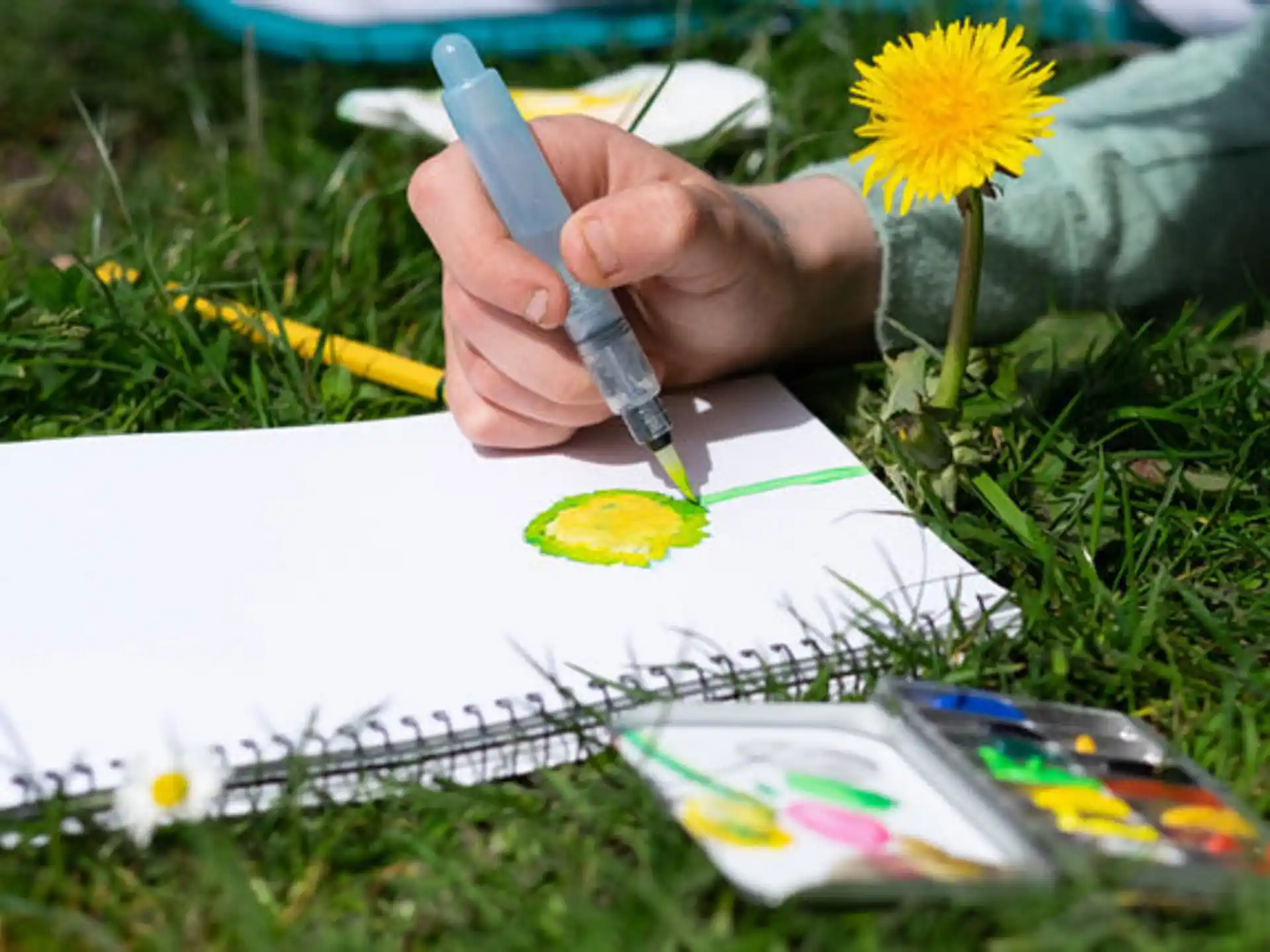 a person writing on a piece of paper