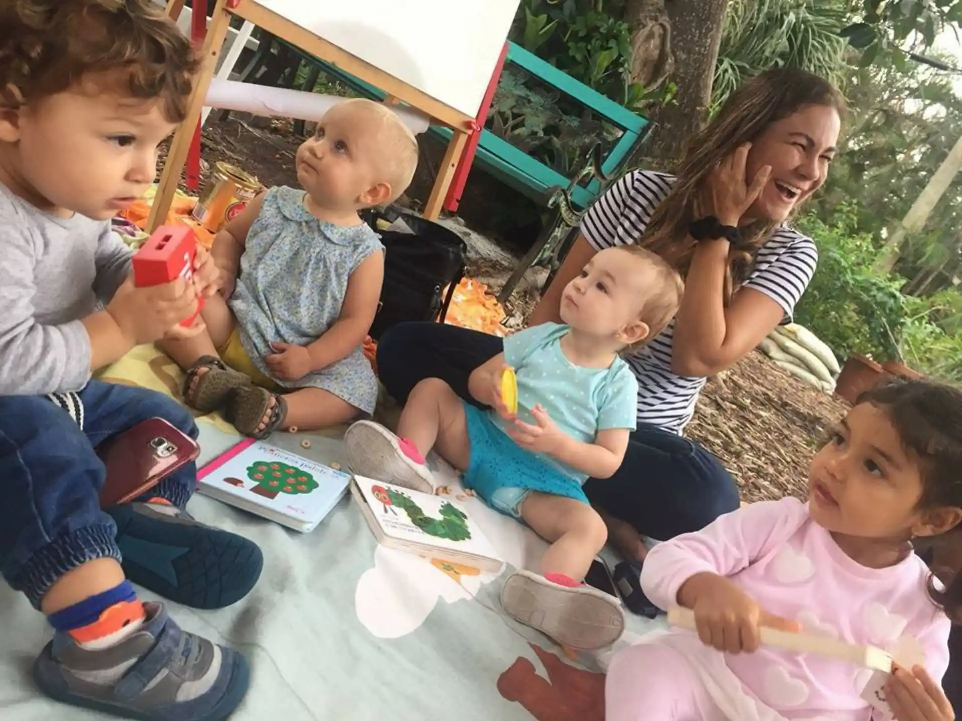 a group of children sitting on the ground