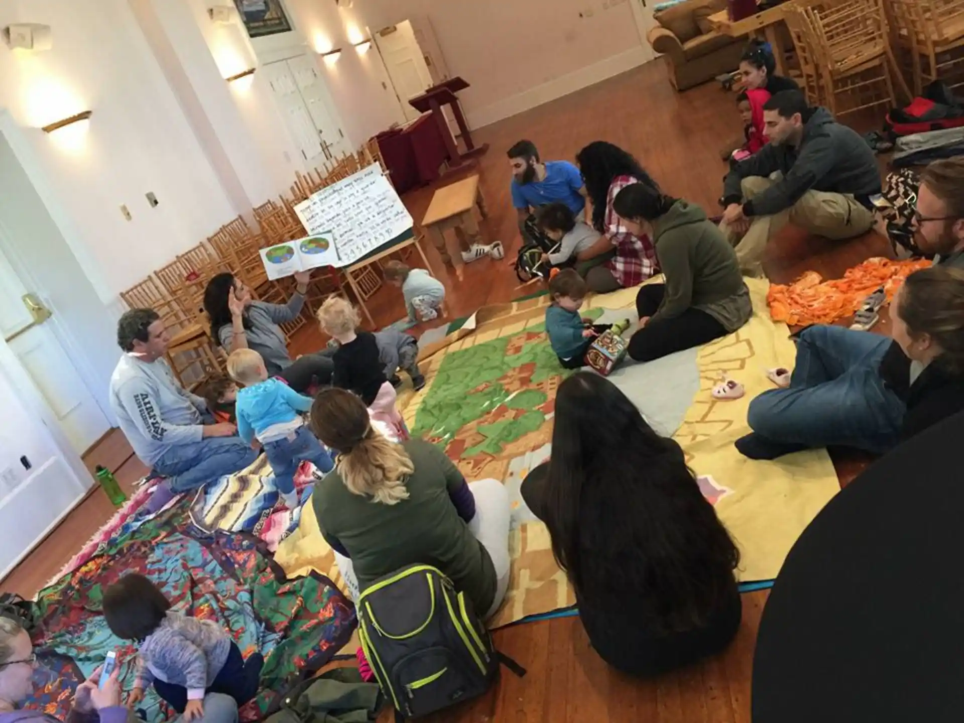 a group of people sitting on the floor