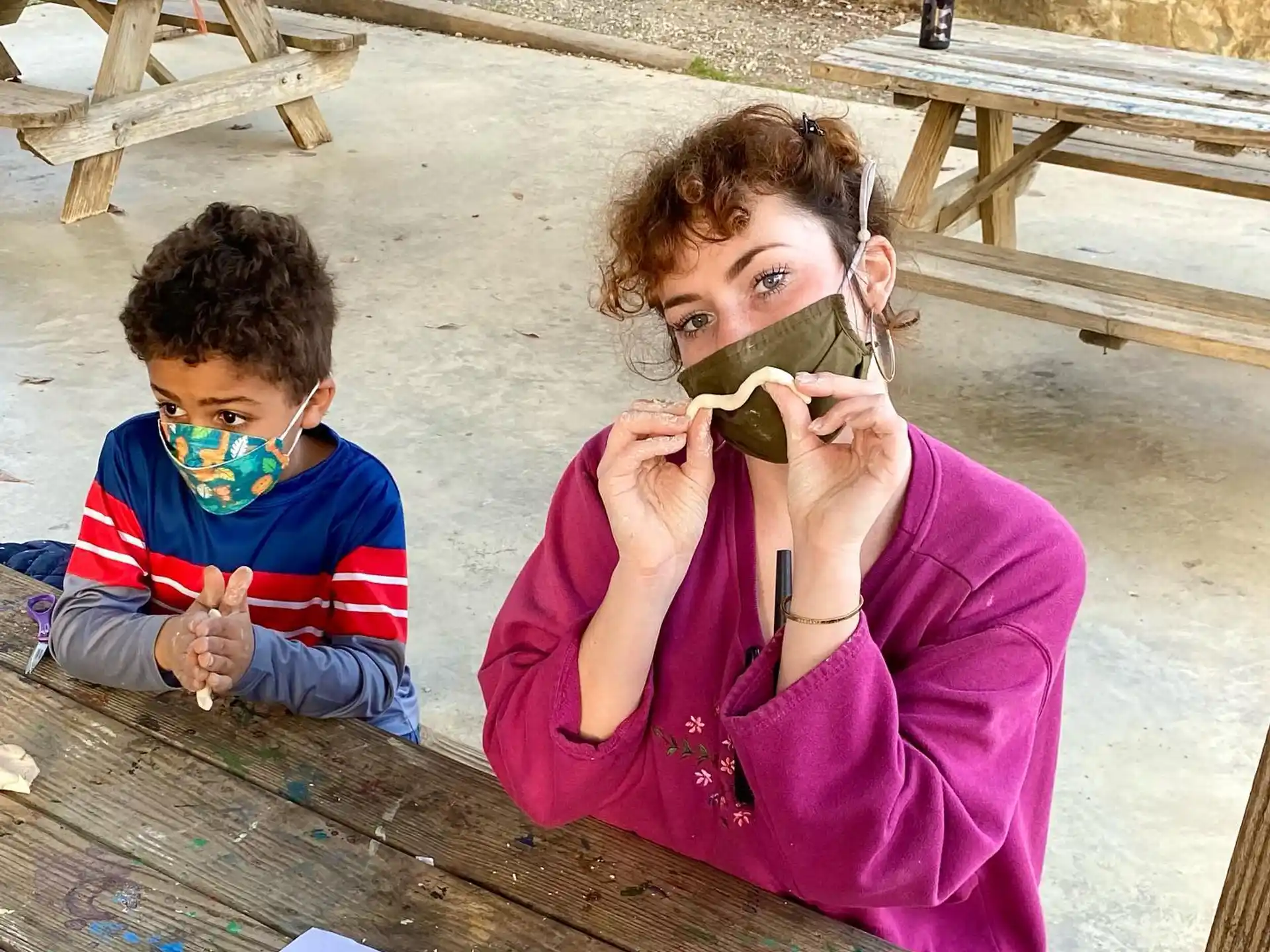 a person and a boy eating