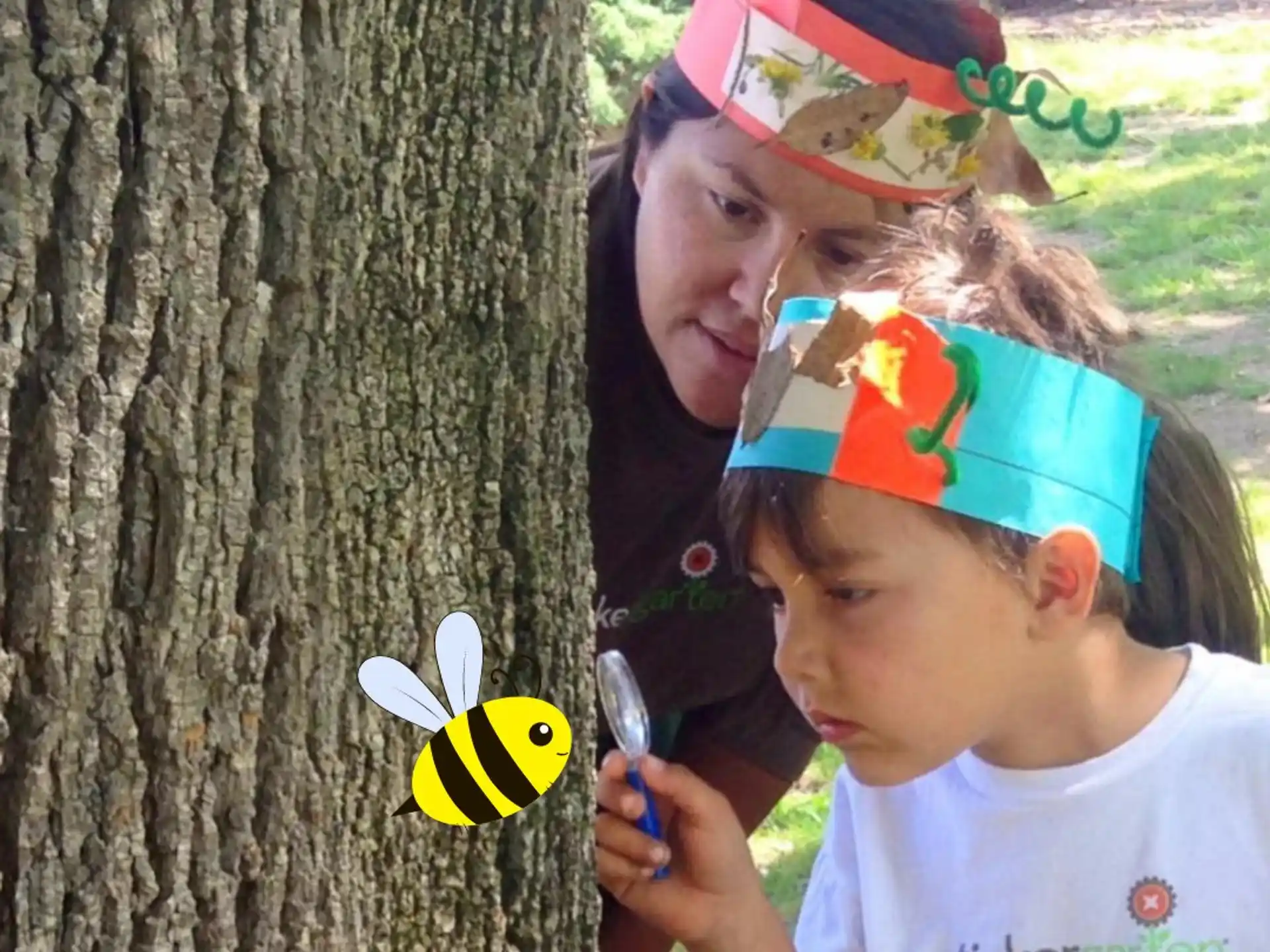 a girl and a boy looking at a tree