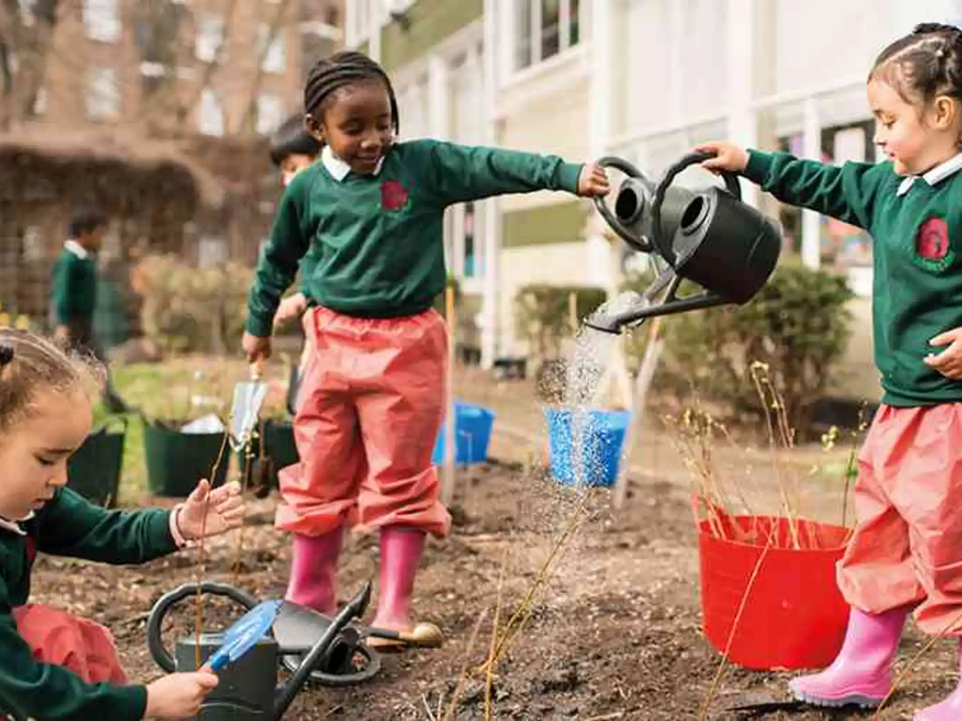 children playing with water bottles