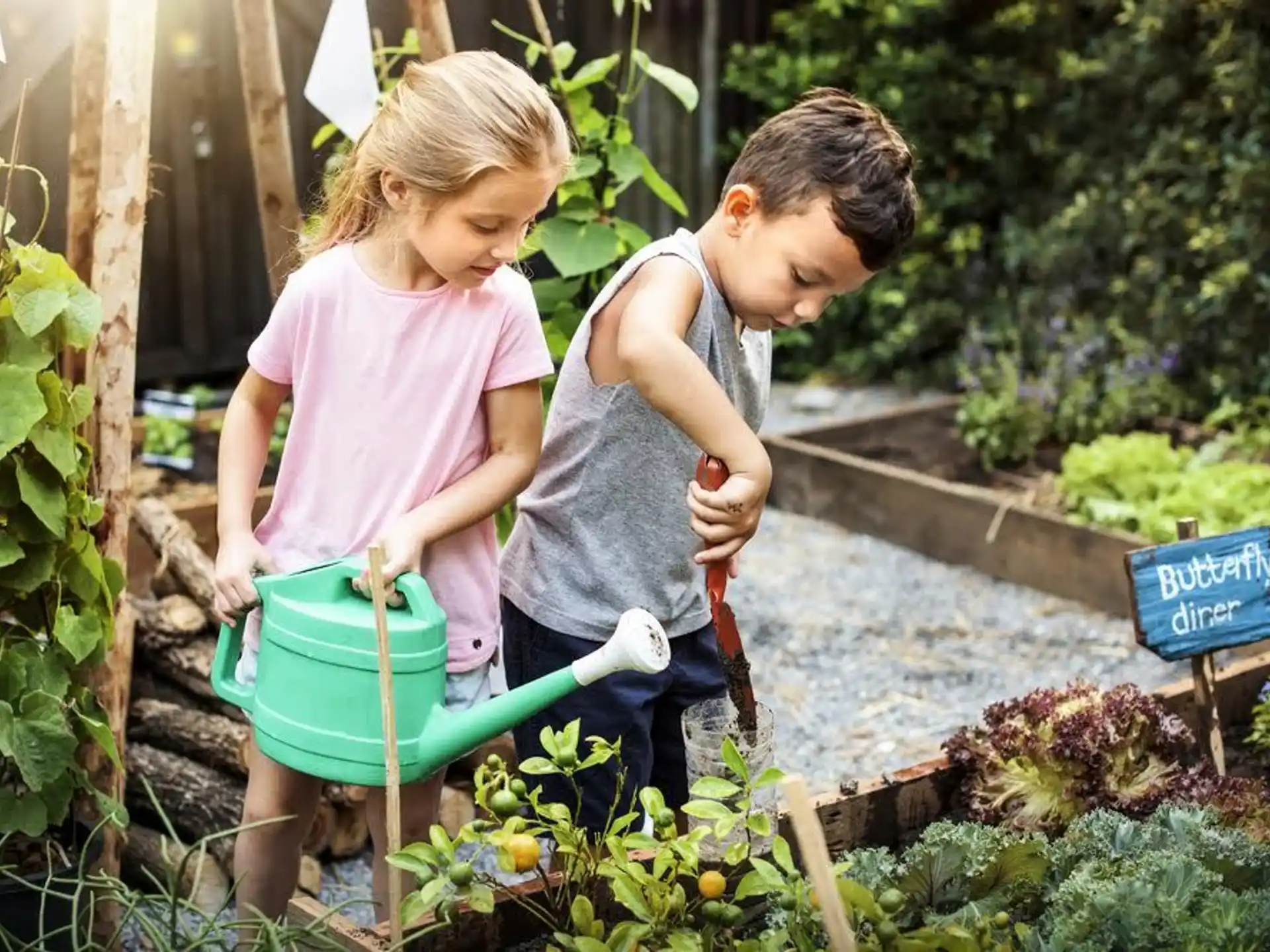 a couple of children working in a garden