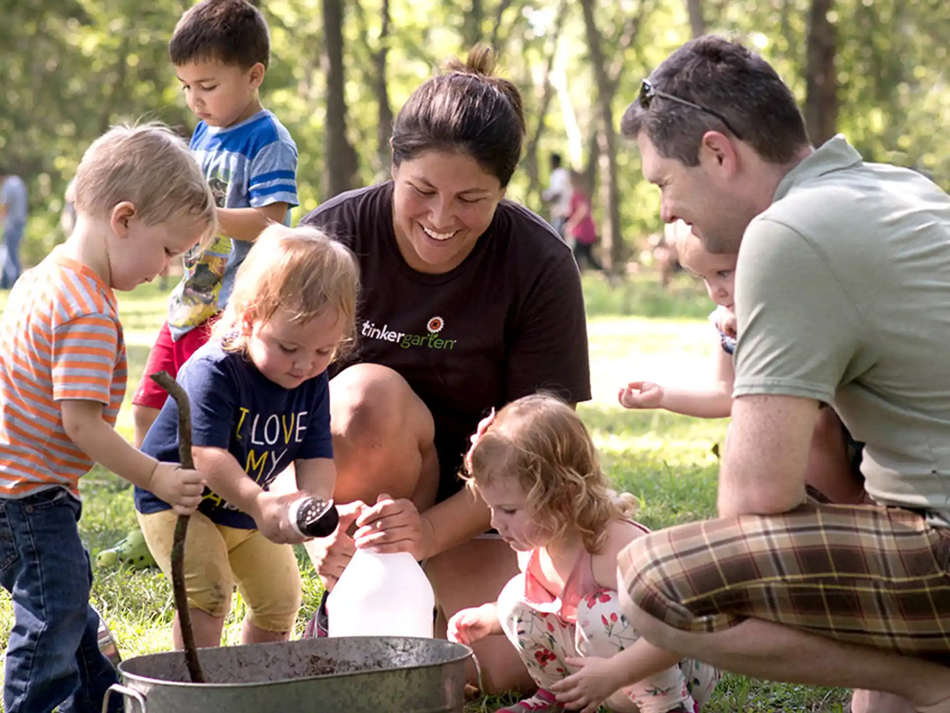 a group of people playing with kids