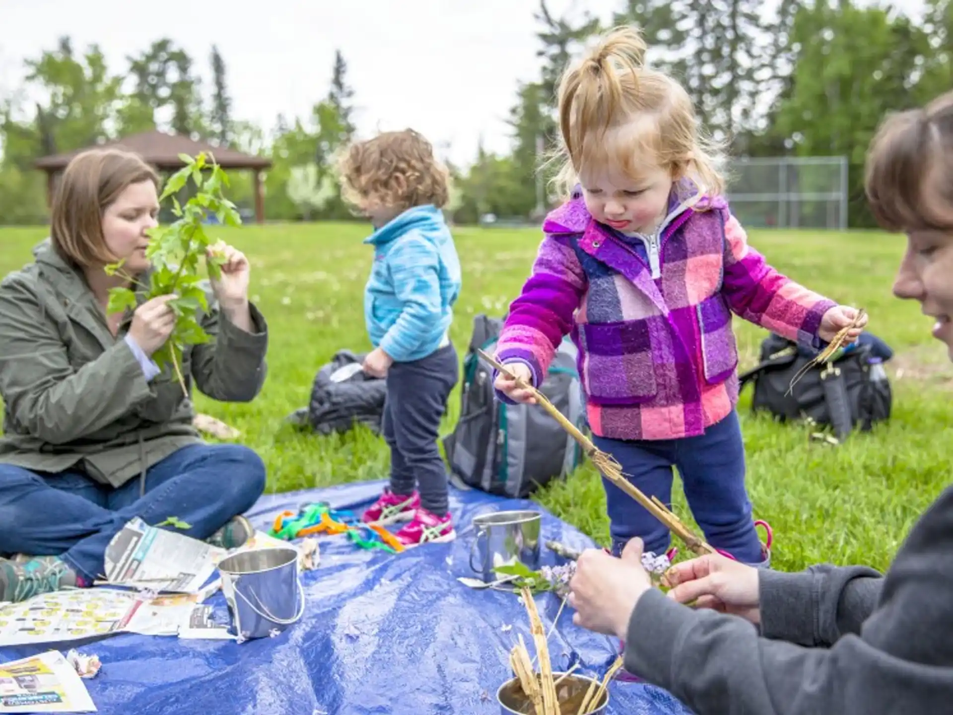 a group of people playing with toys