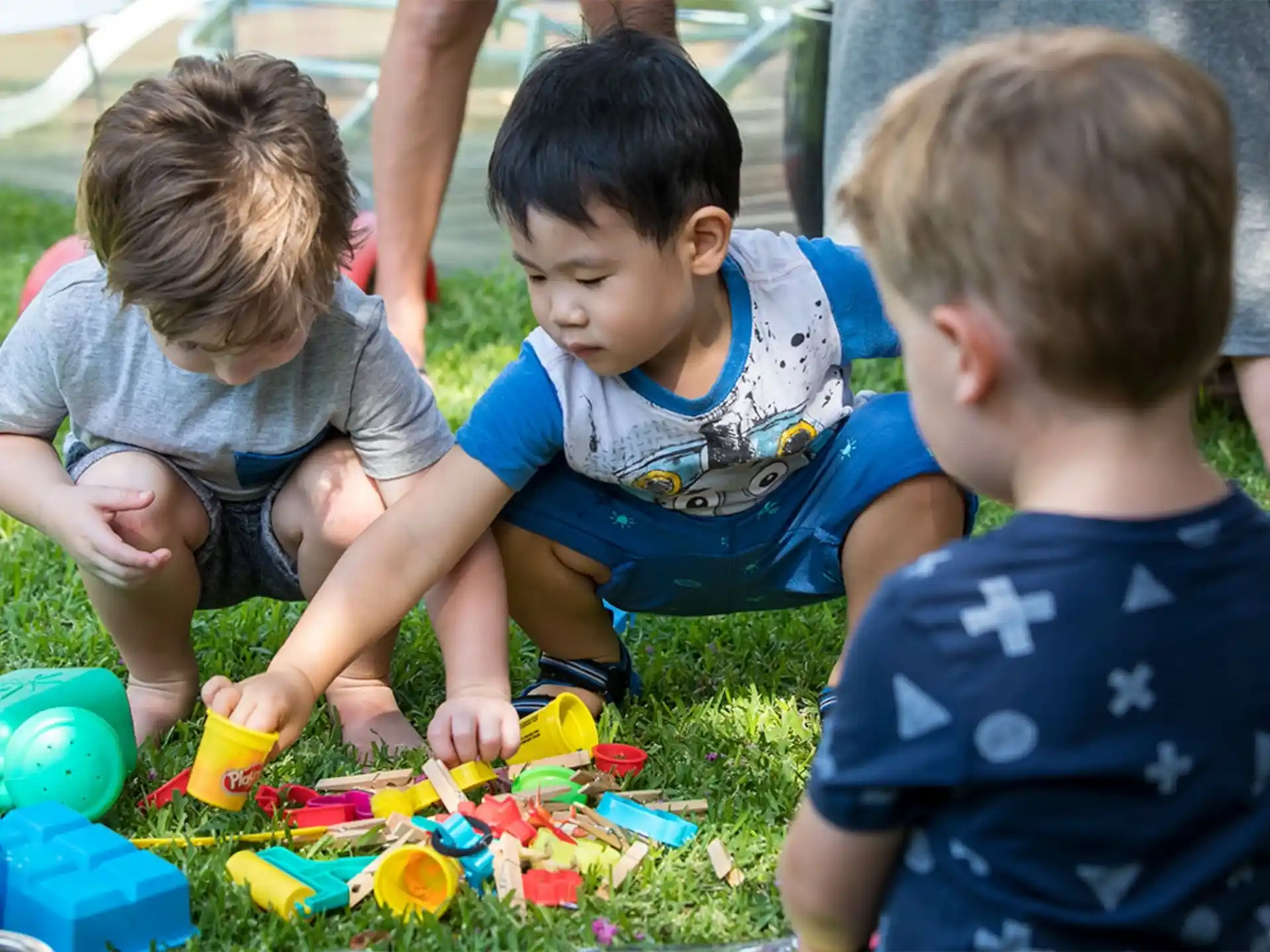 a group of children playing with toys
