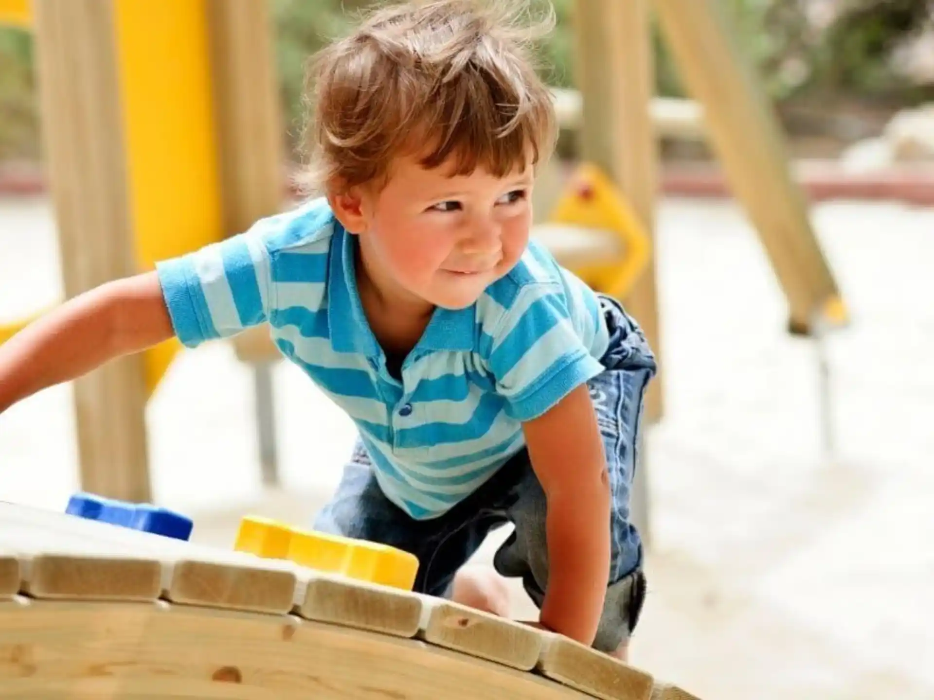 a boy playing with a toy
