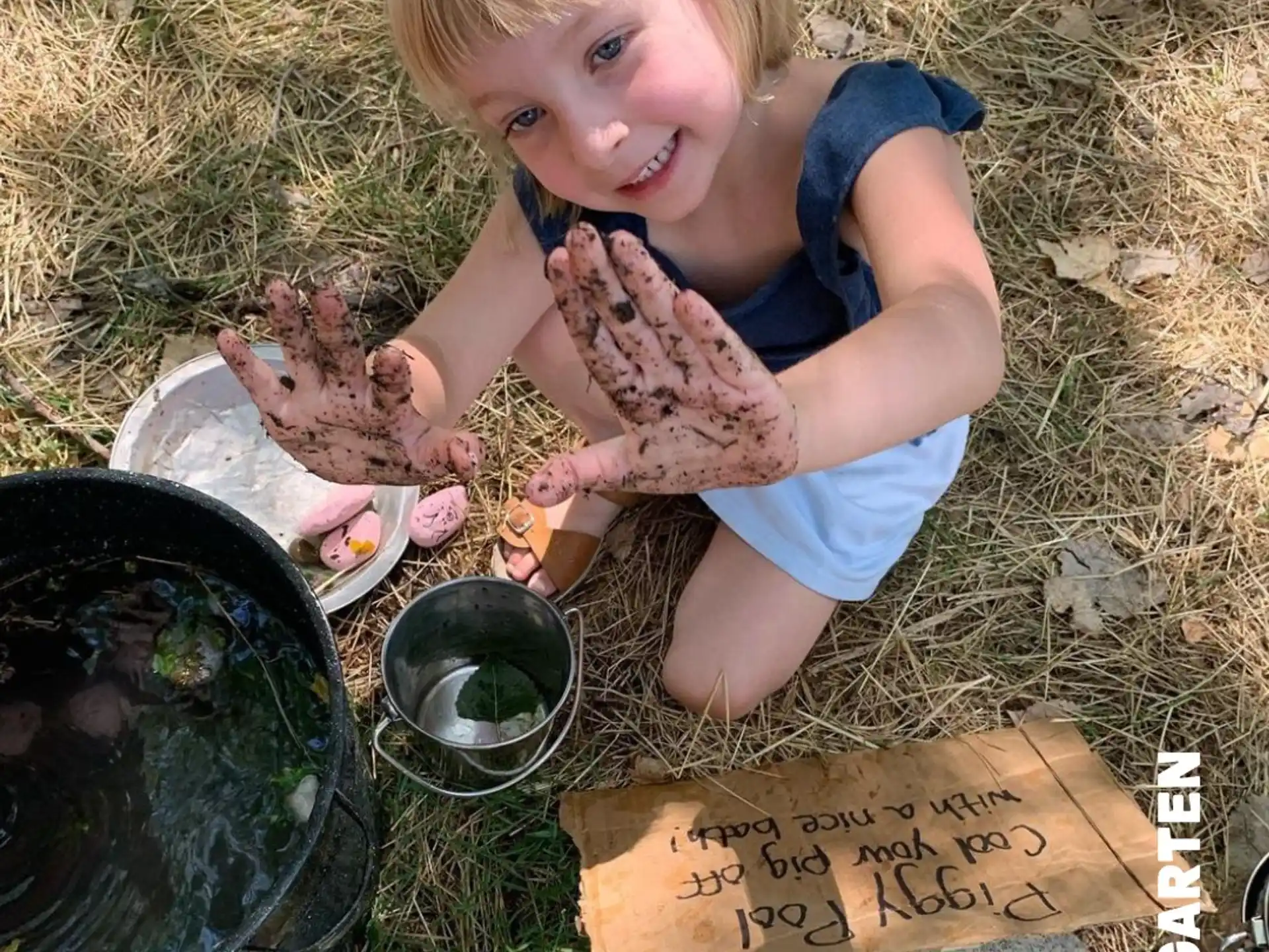 a young girl holding a baby turtle