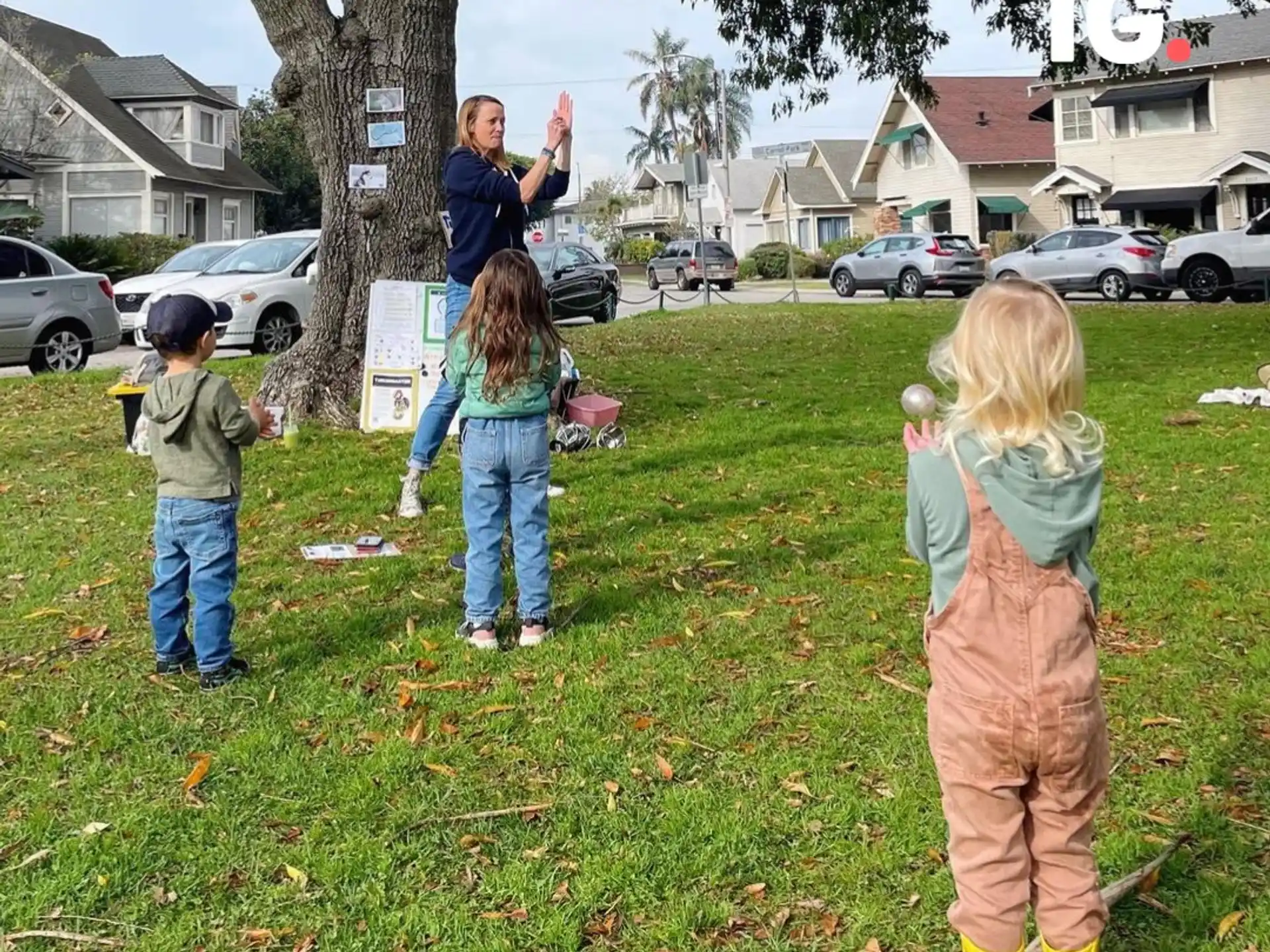 a group of children playing in a yard