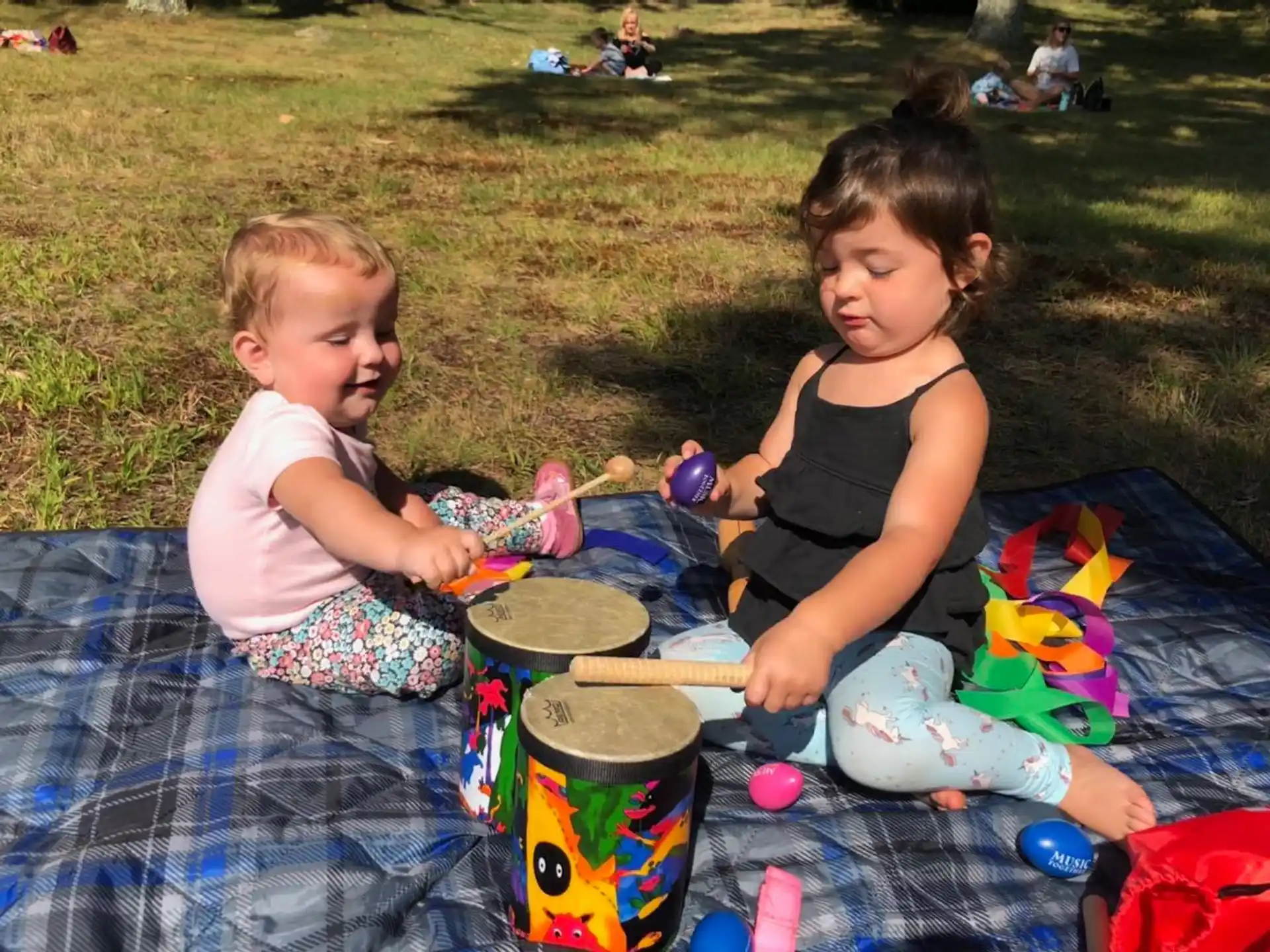 a couple of children playing with toys