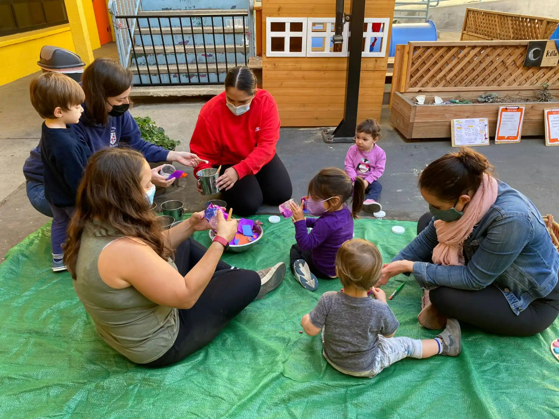 a group of people sitting on the ground