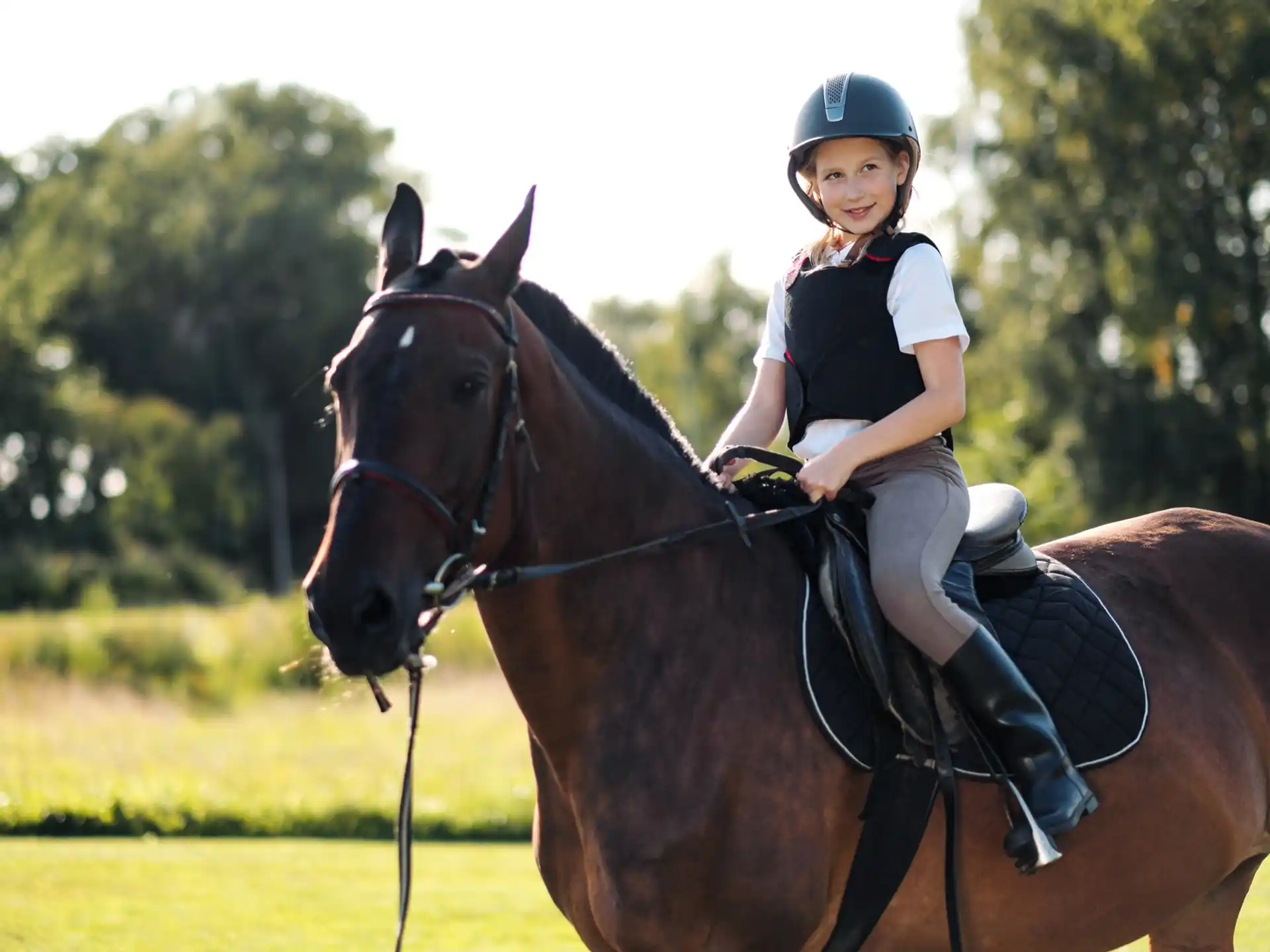 a girl riding a horse