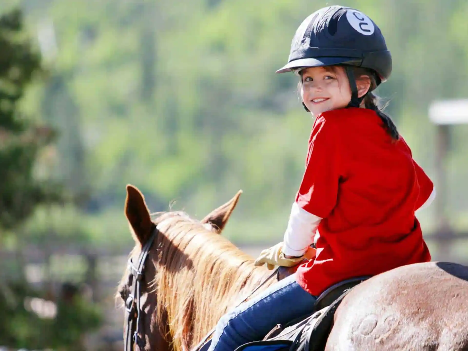 a girl riding a horse