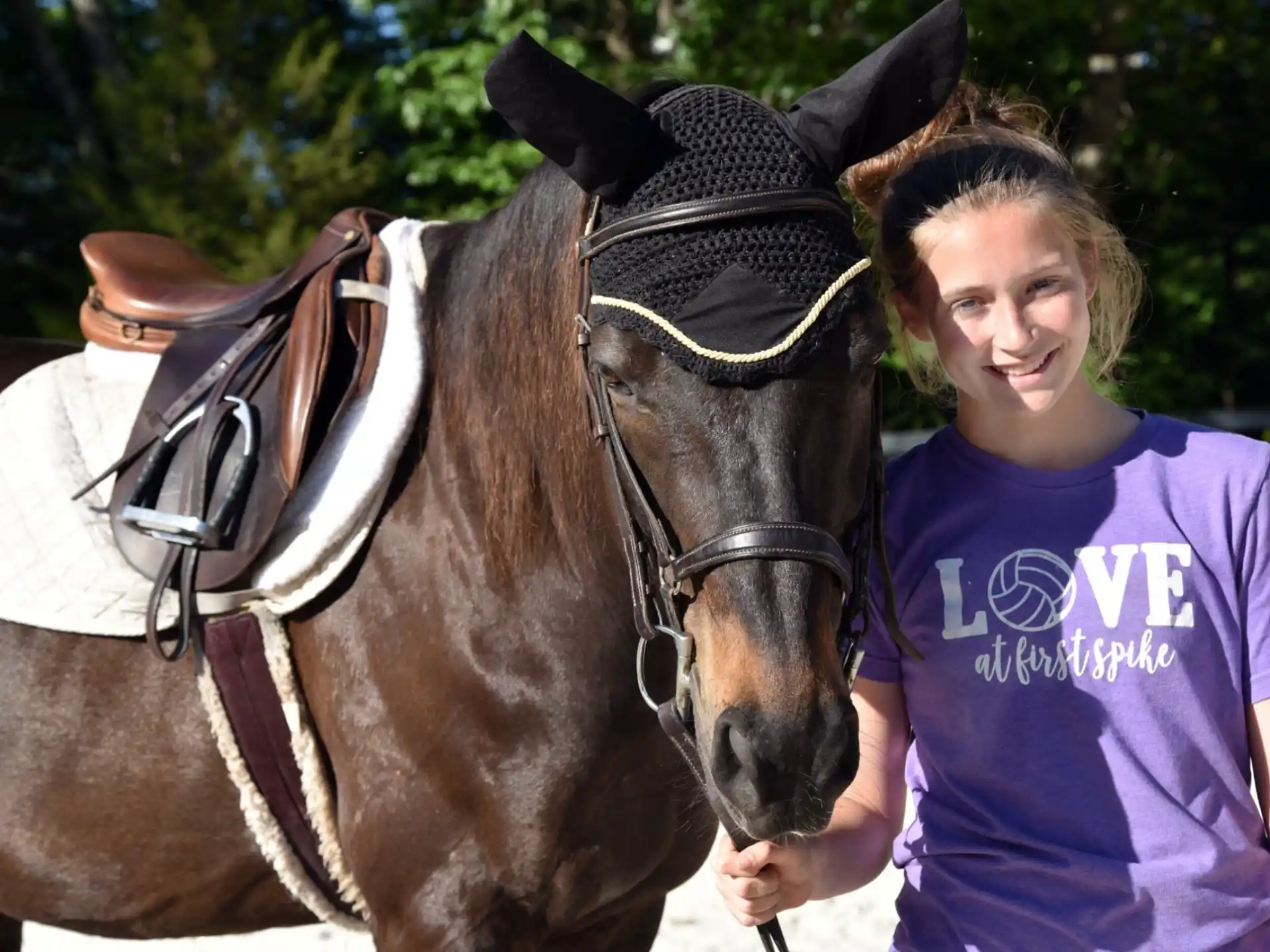 a person standing next to a horse