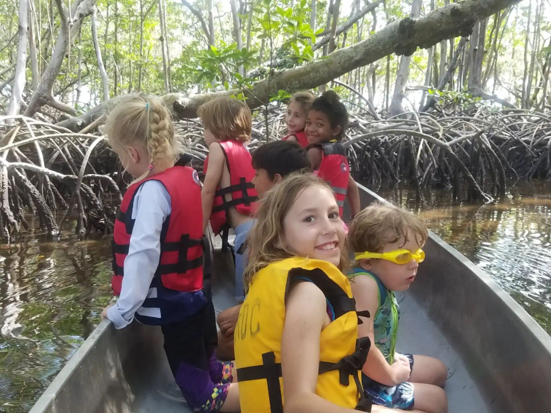 a group of children on a boat