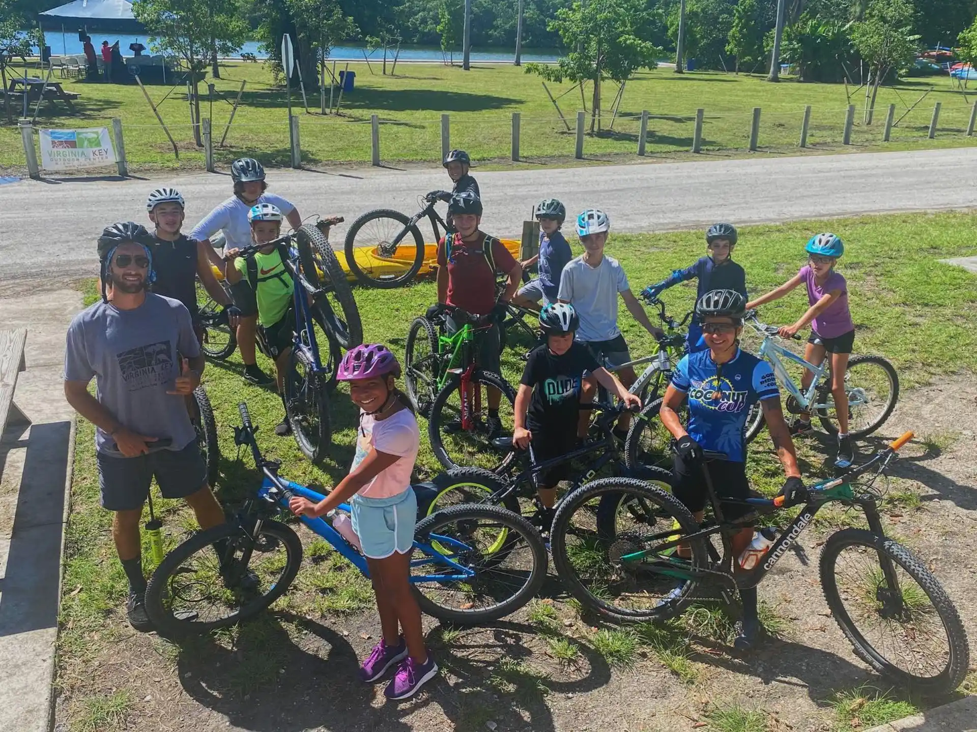 a group of people with bicycles