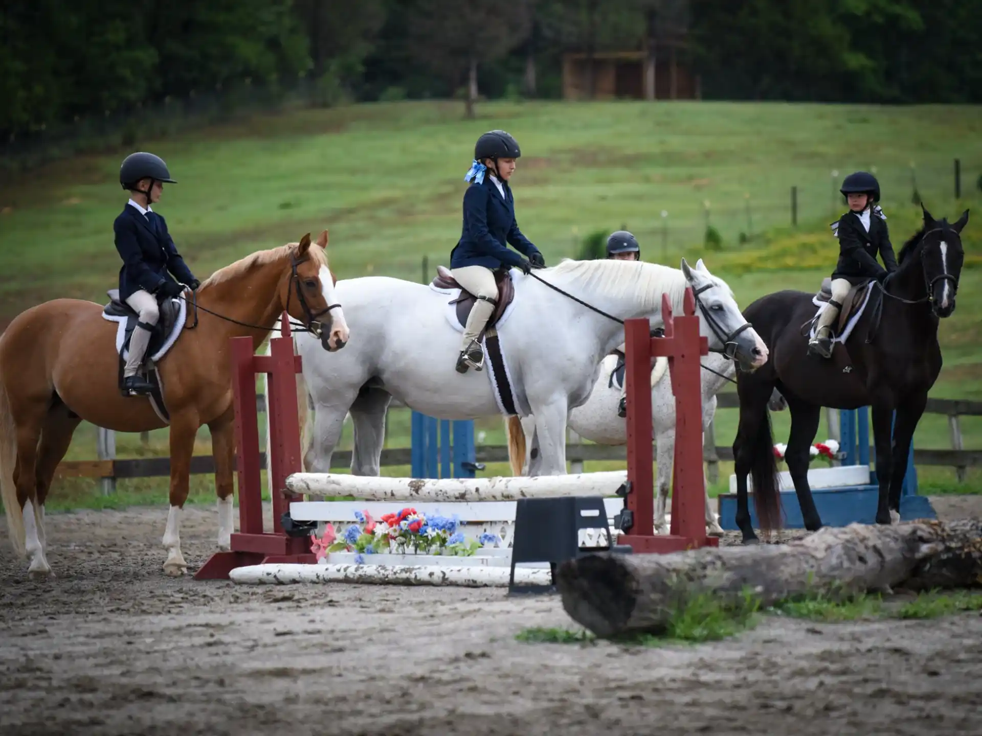 a group of people riding horses