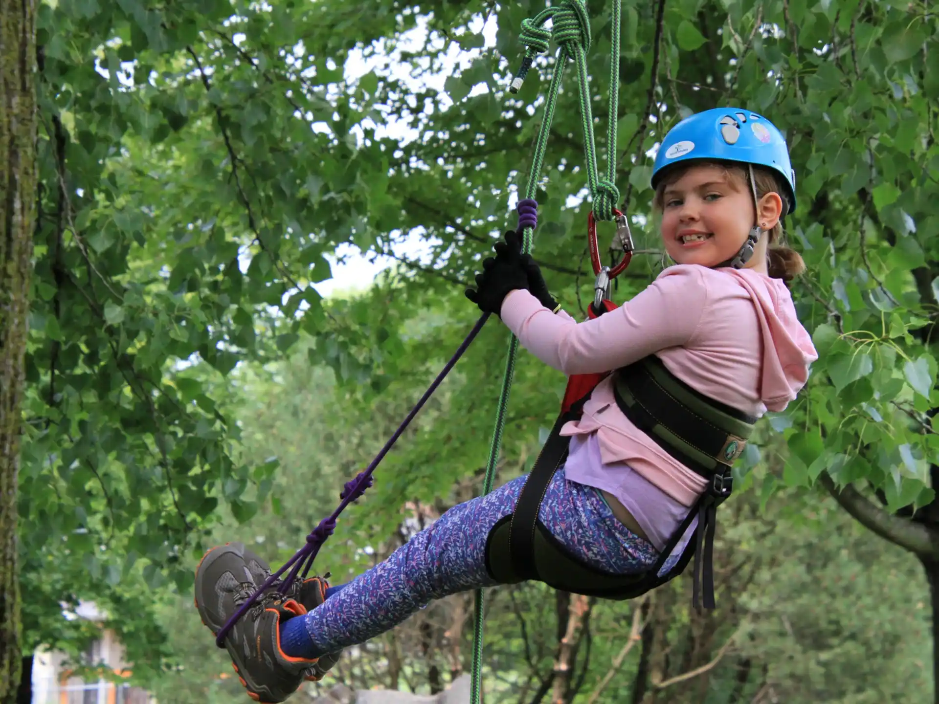 a girl on a zip line
