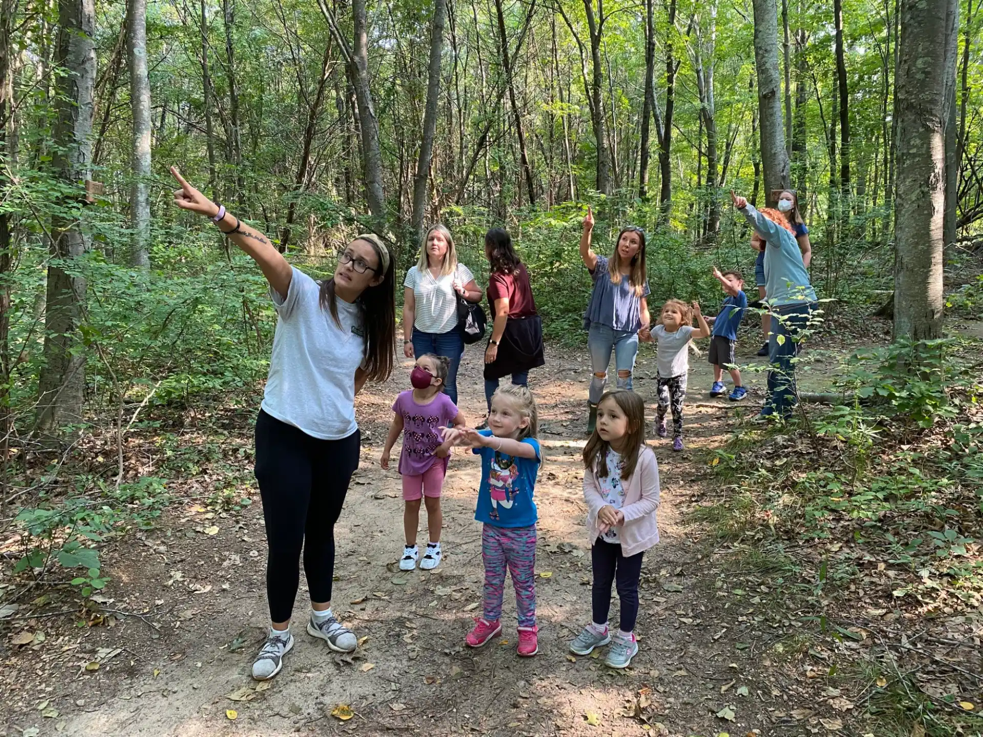 a group of people in the woods