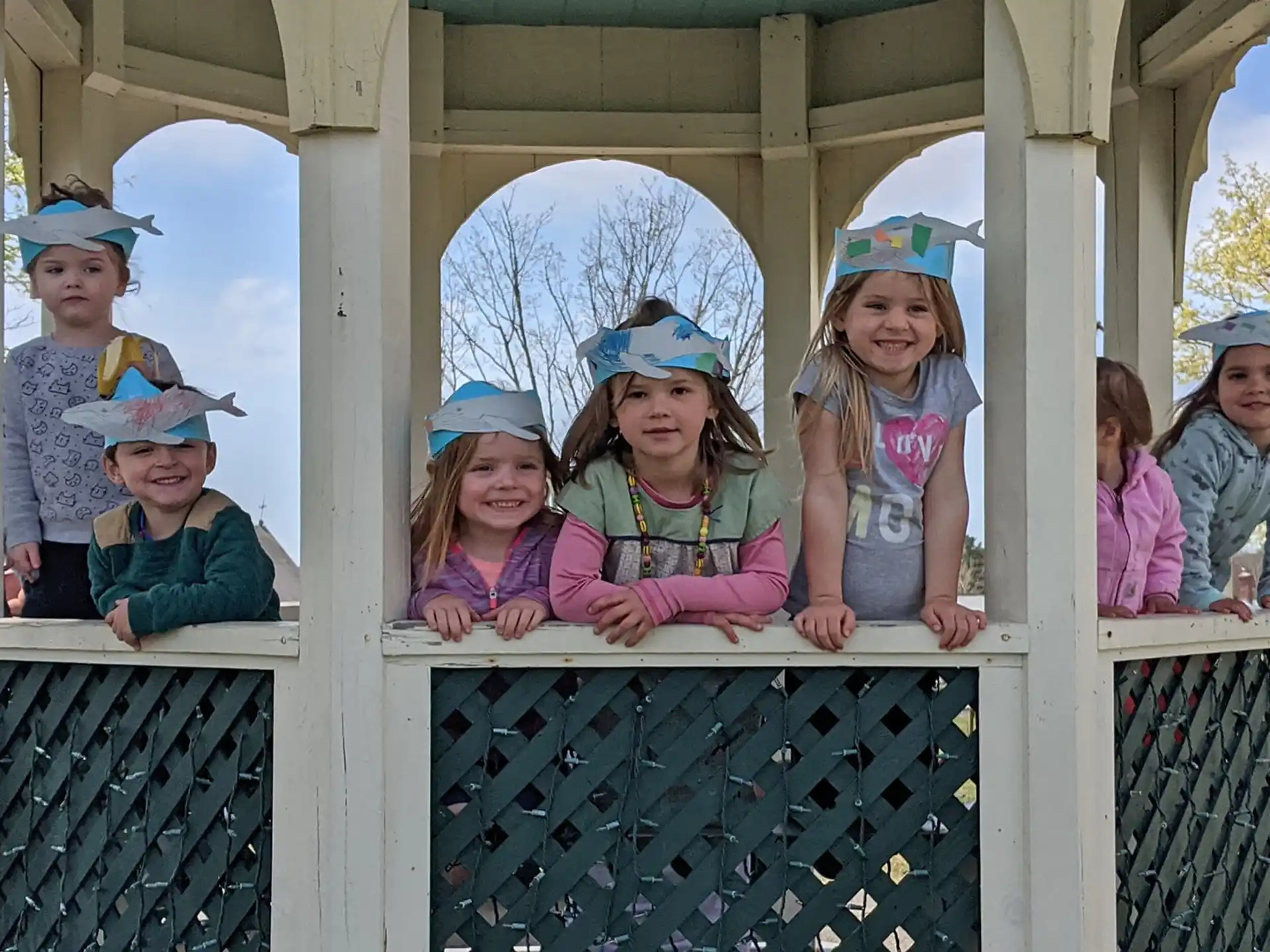 a group of children wearing hats