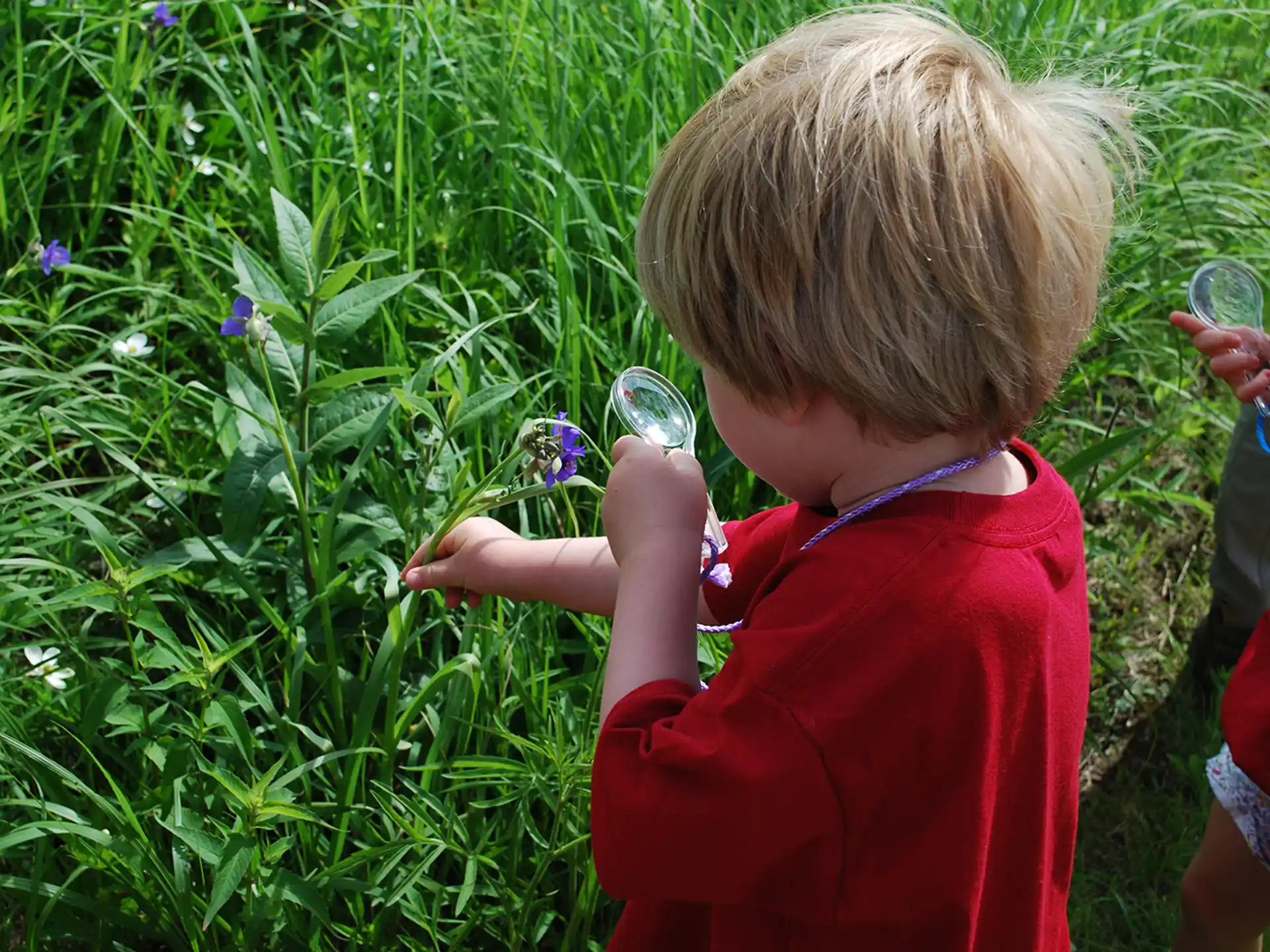 a child holding a bottle