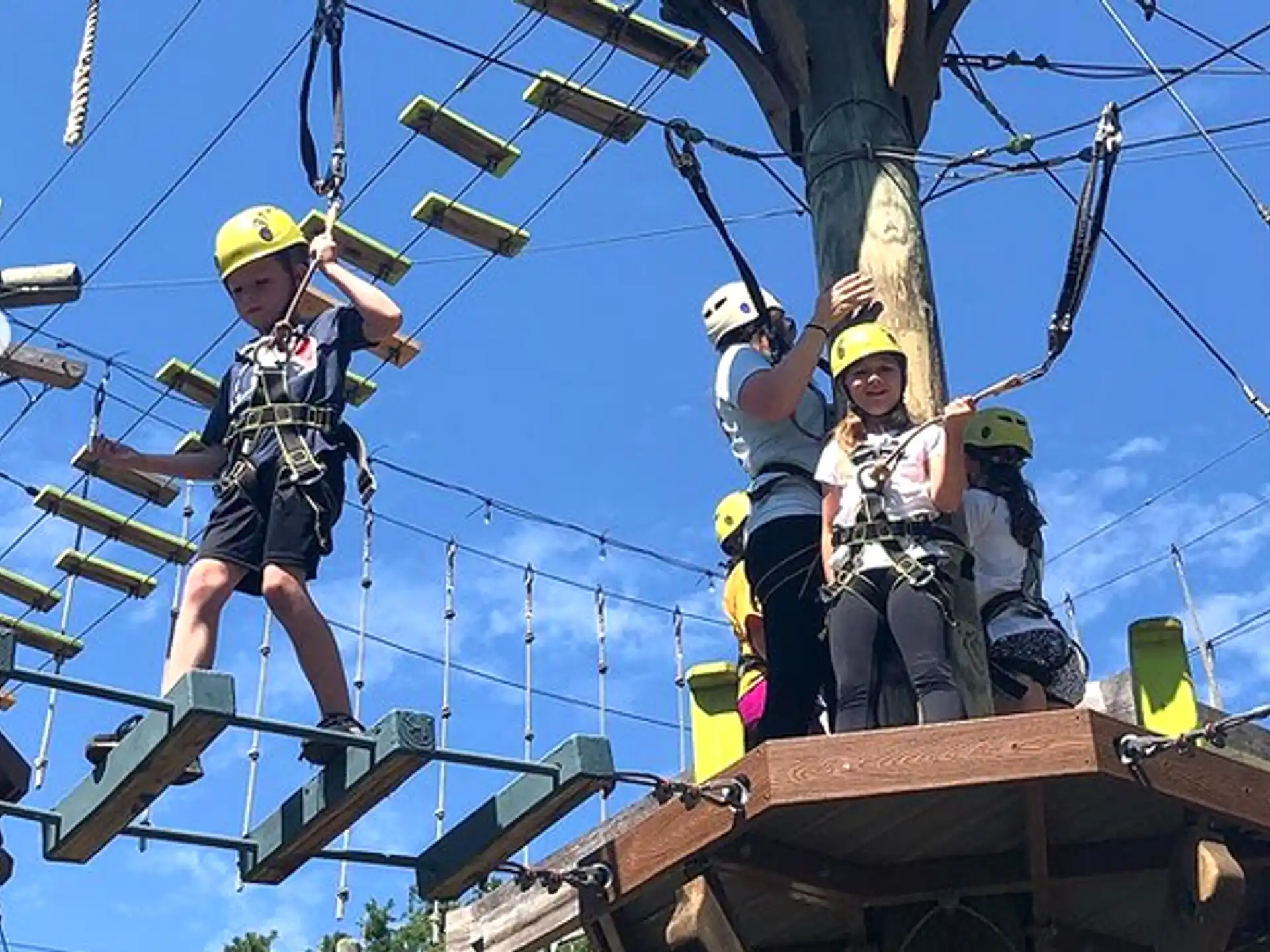 a group of people on a wooden structure