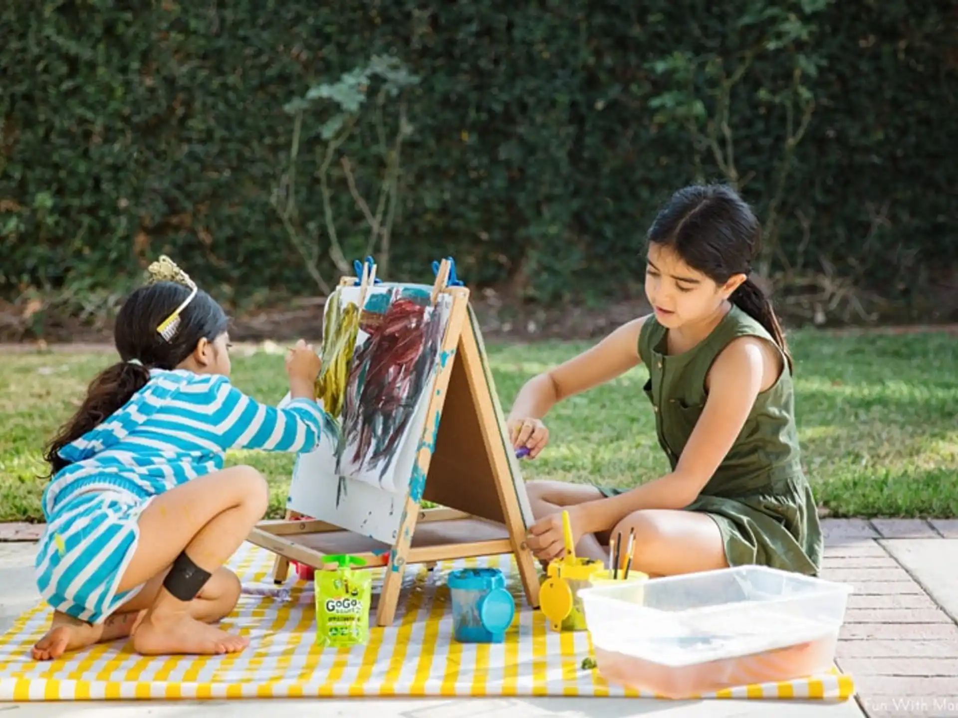 a few young girls painting