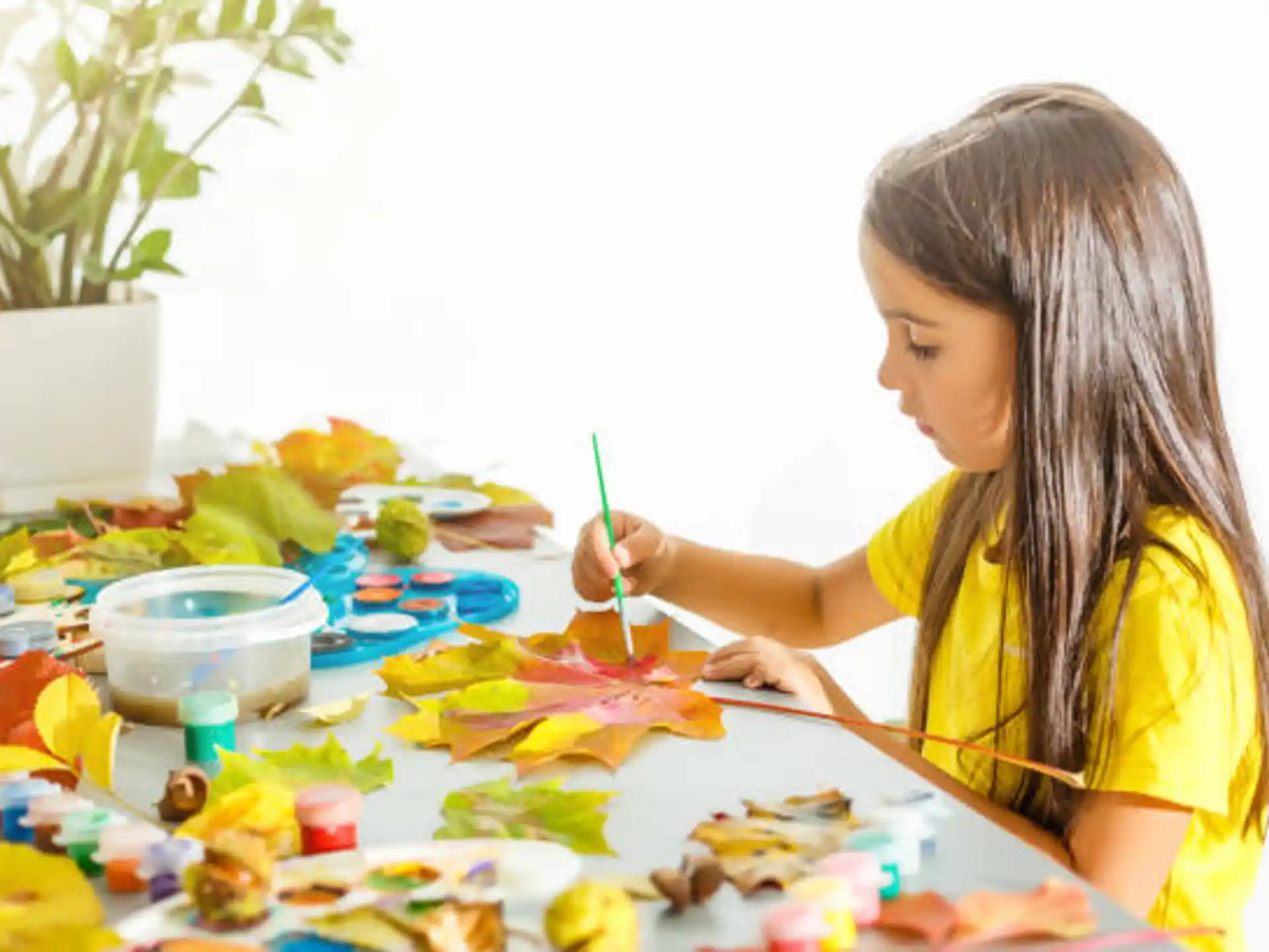 a girl painting on a table