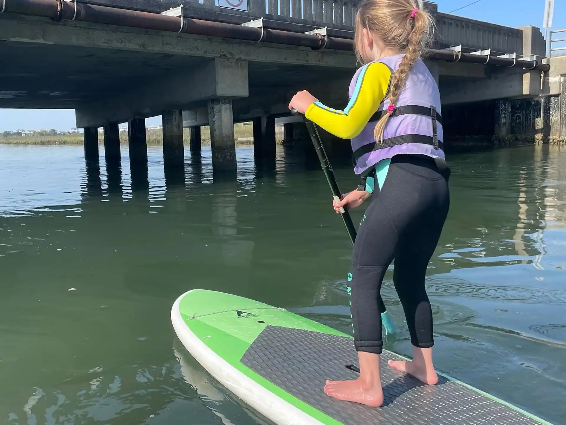 a woman on a paddle board