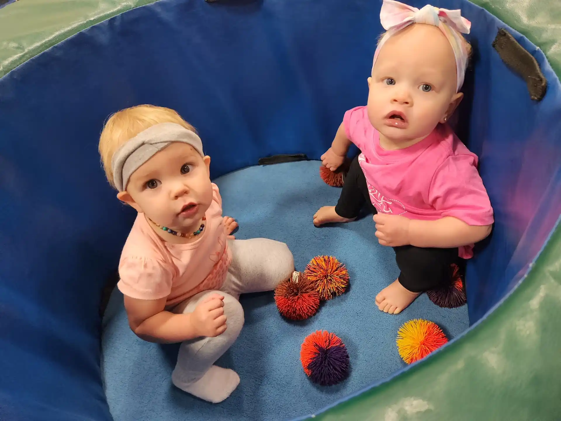 two babies on a mat