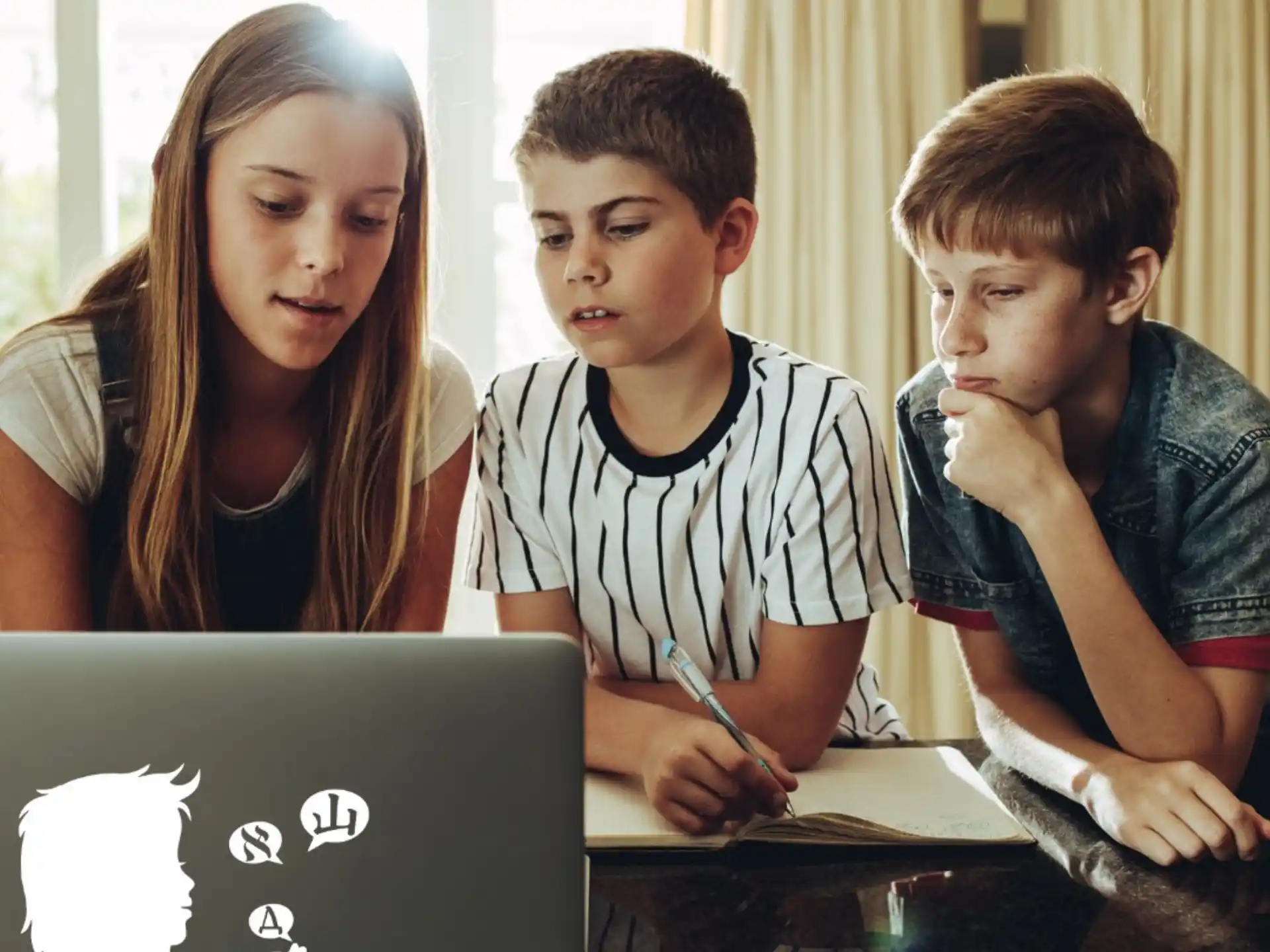 a group of people looking at a laptop