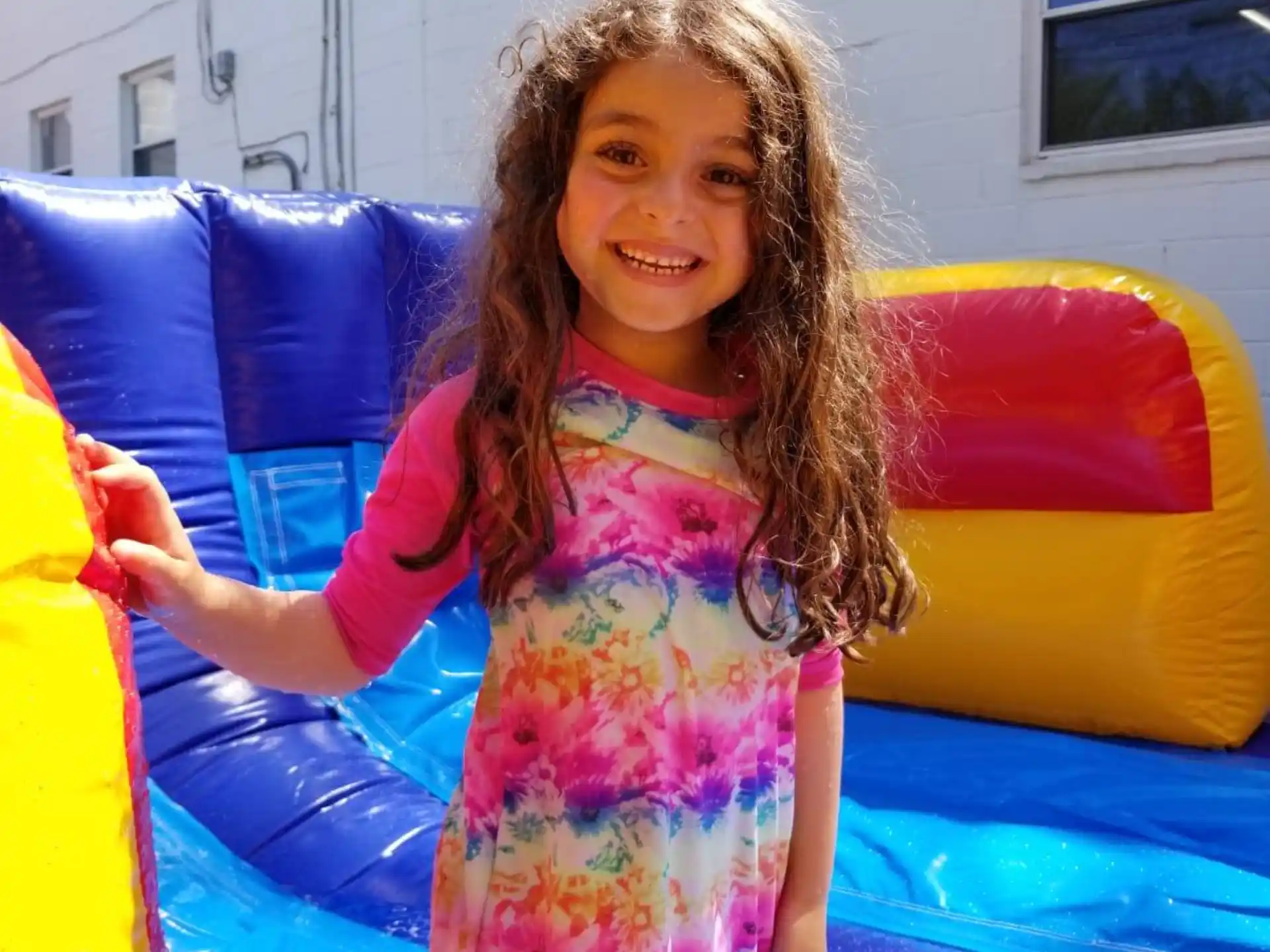 a girl in a colorful dress