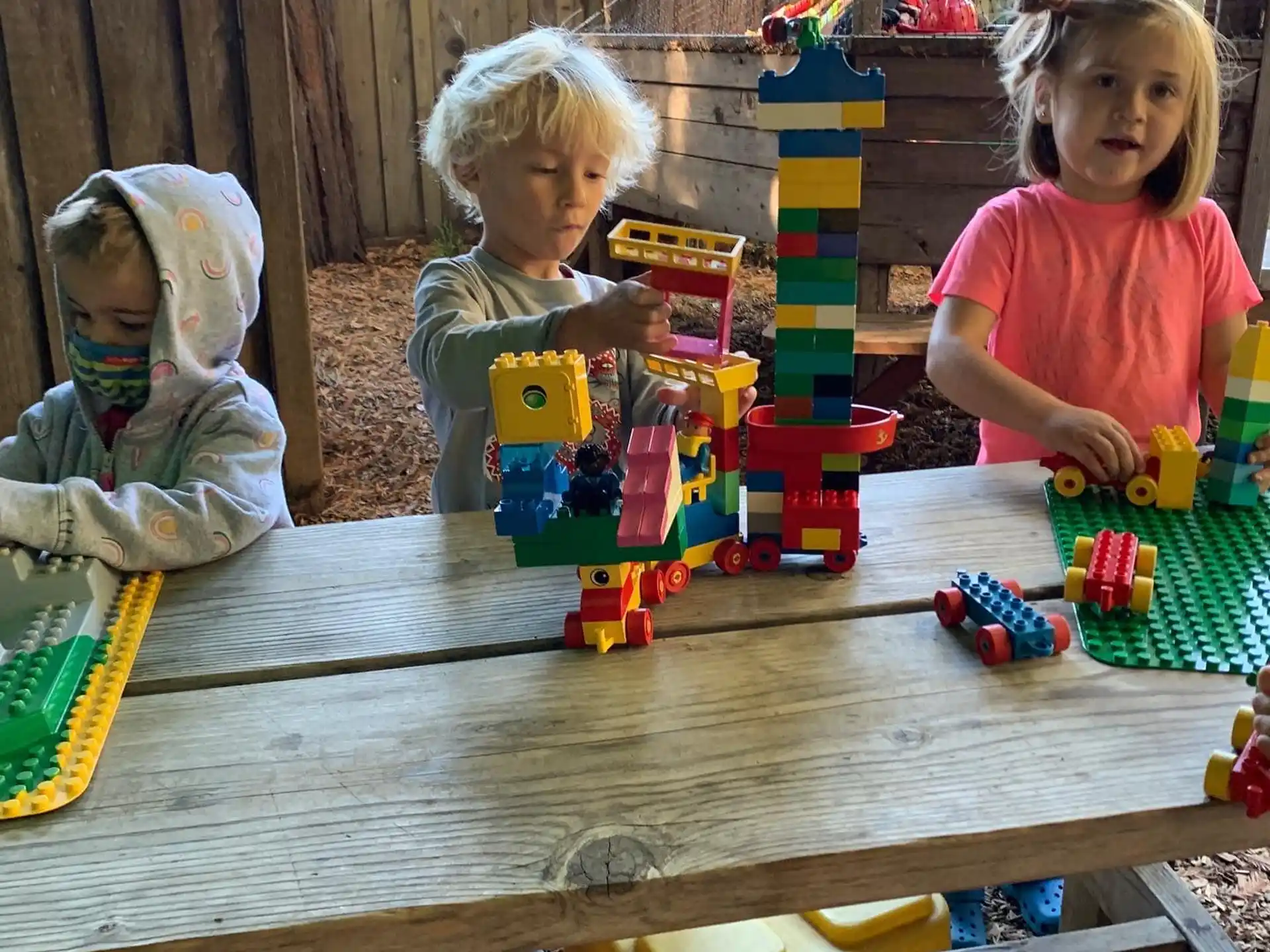 a couple of children playing with toys