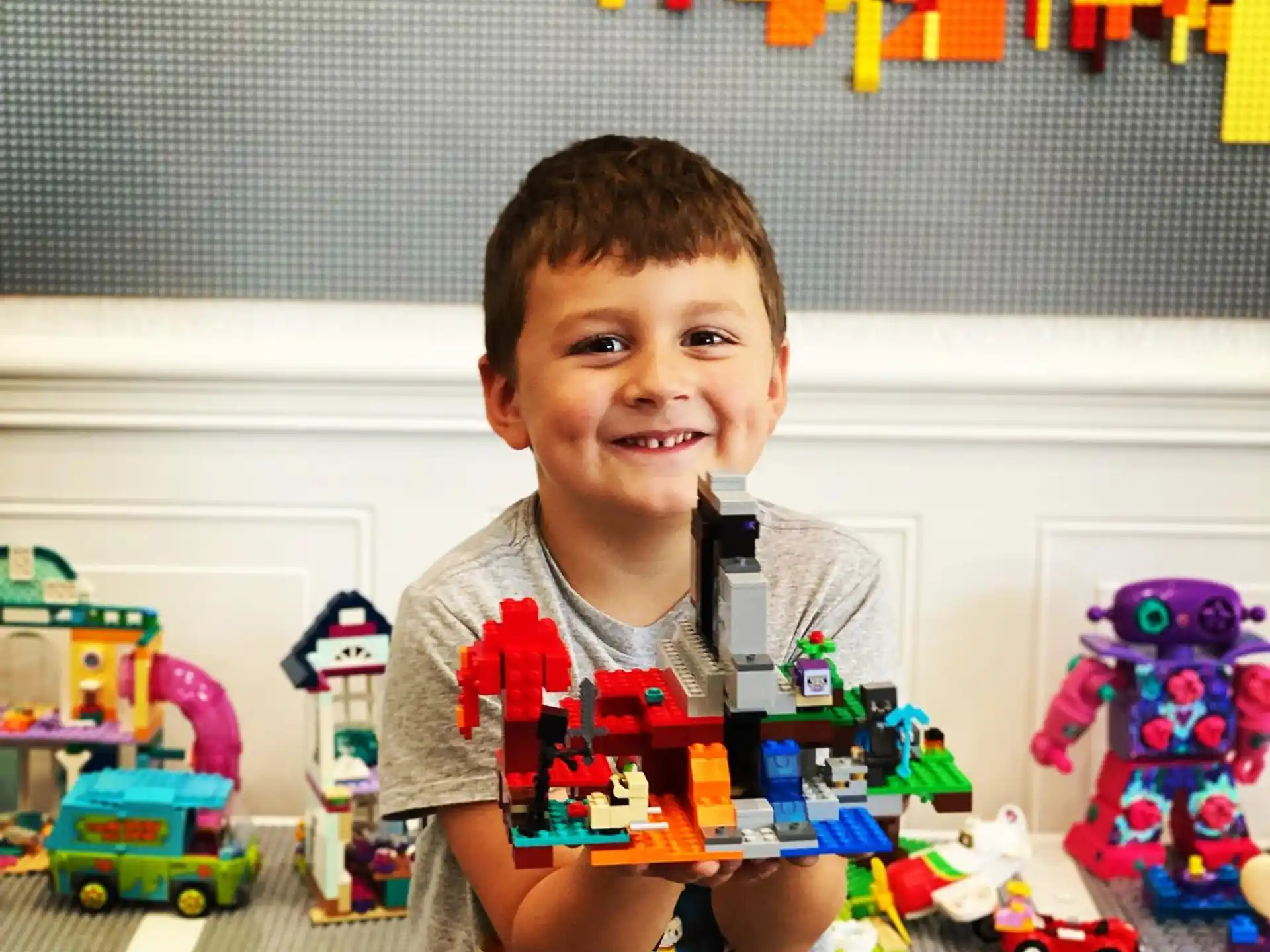 a boy holding a toy