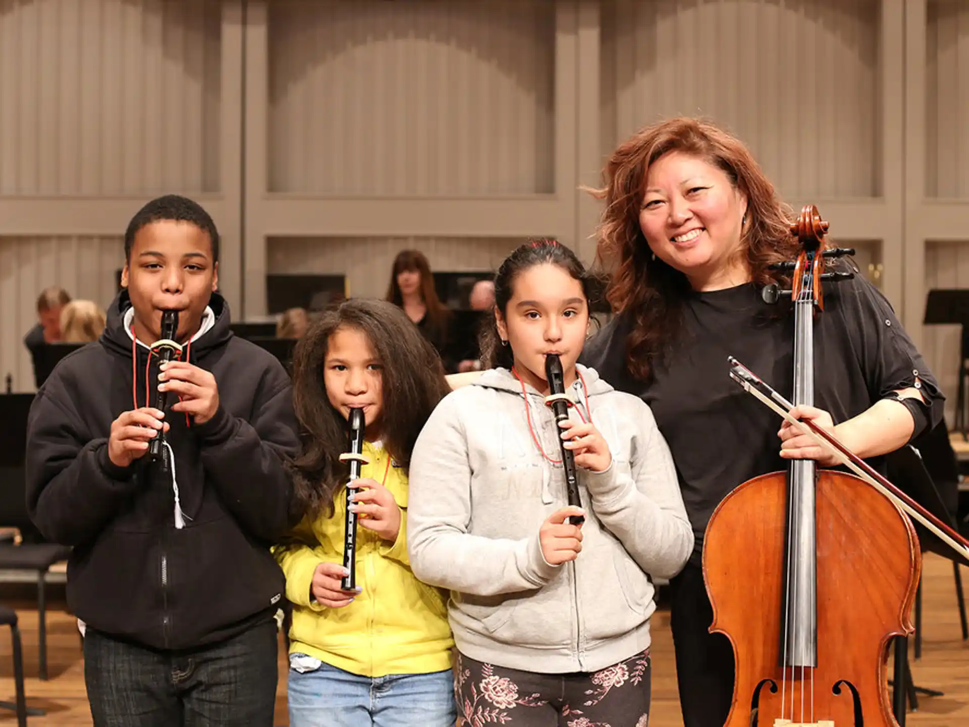 a group of people holding musical instruments