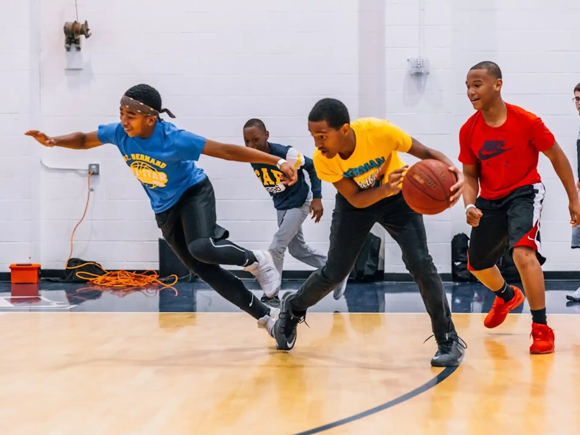 a group of men playing basketball