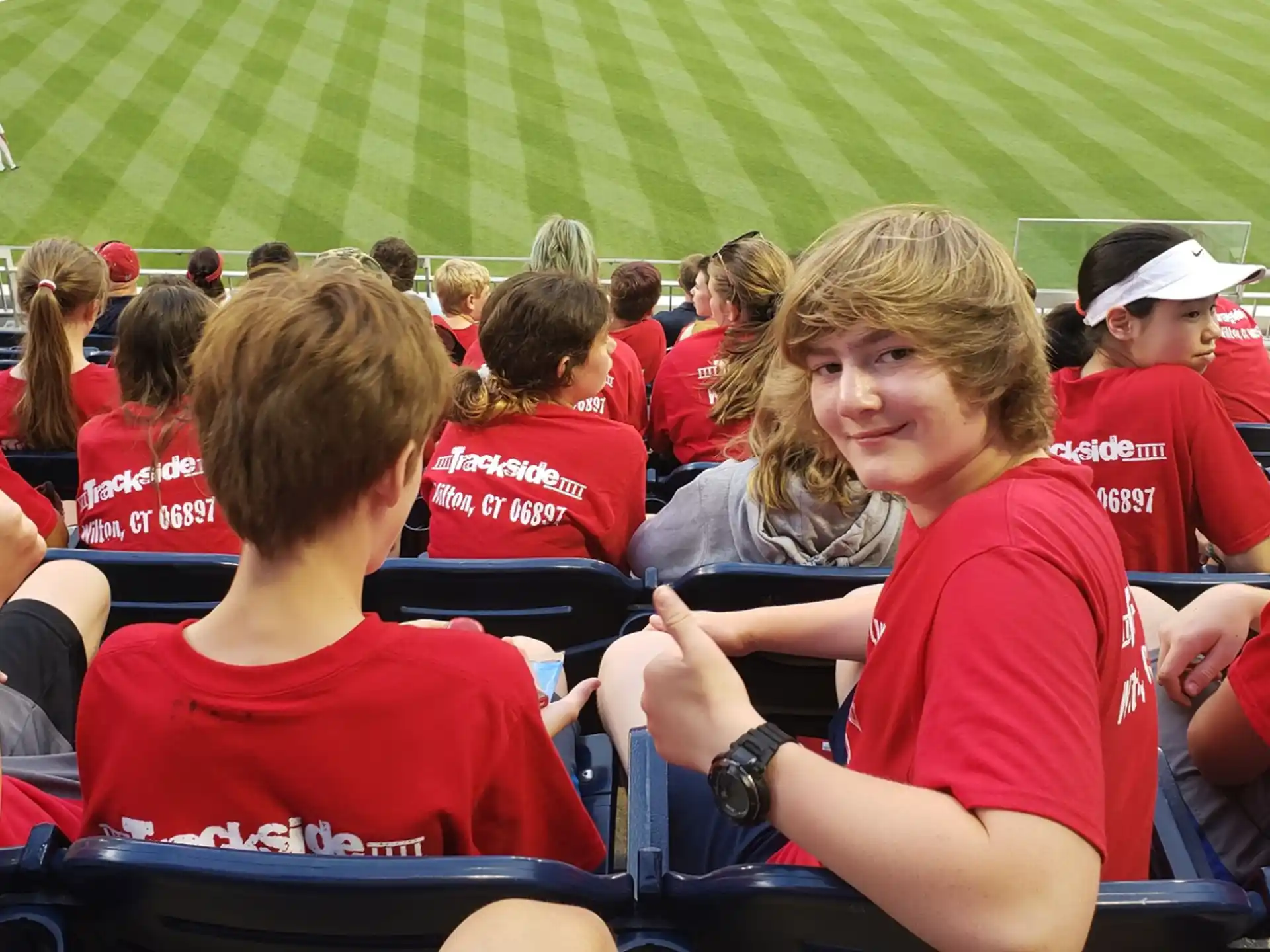a group of people sitting in a stadium
